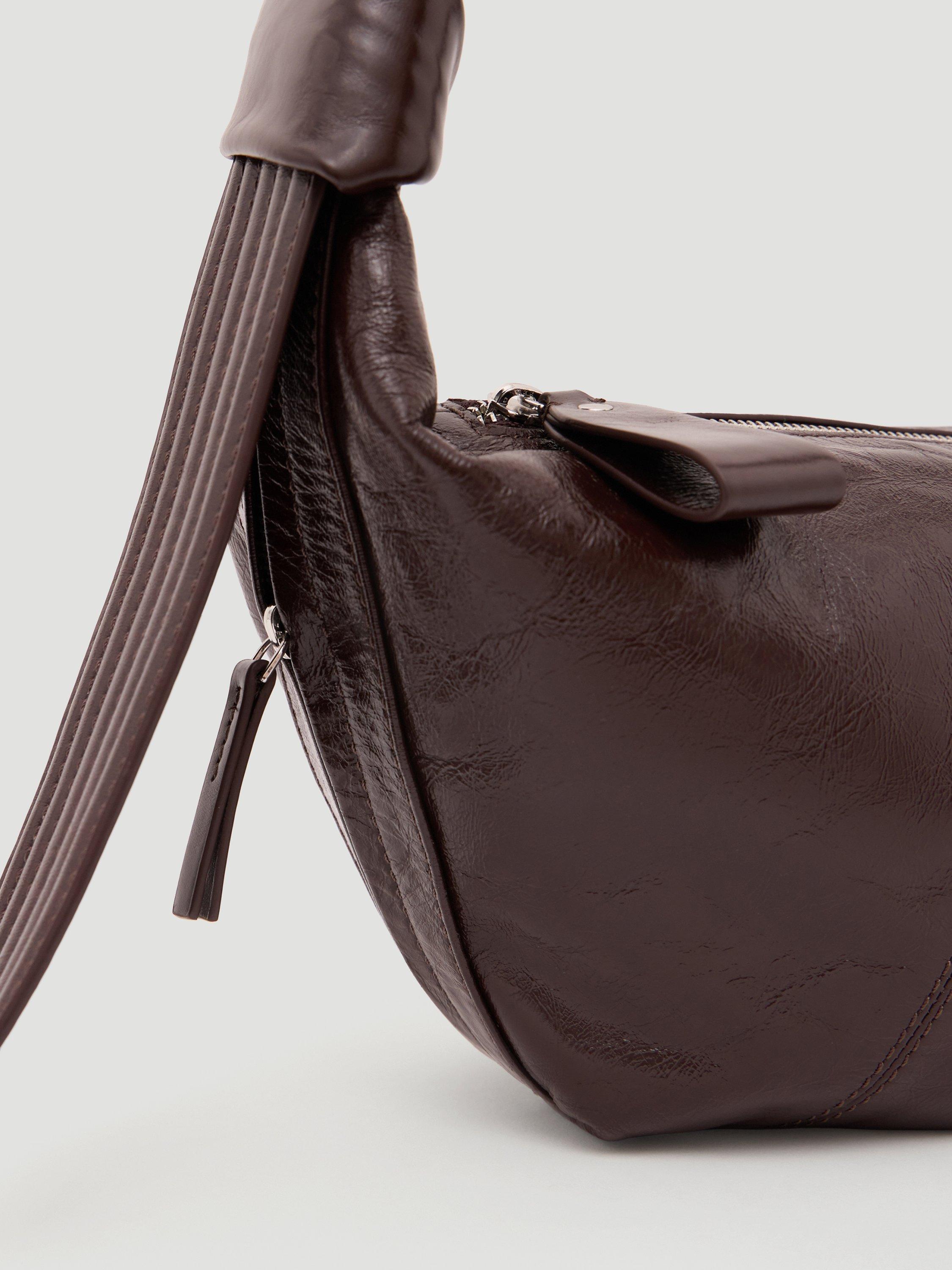 Product image 4 of 6, which shows HUSH Leather Crescent Boho Bag, Chocolate, One Size