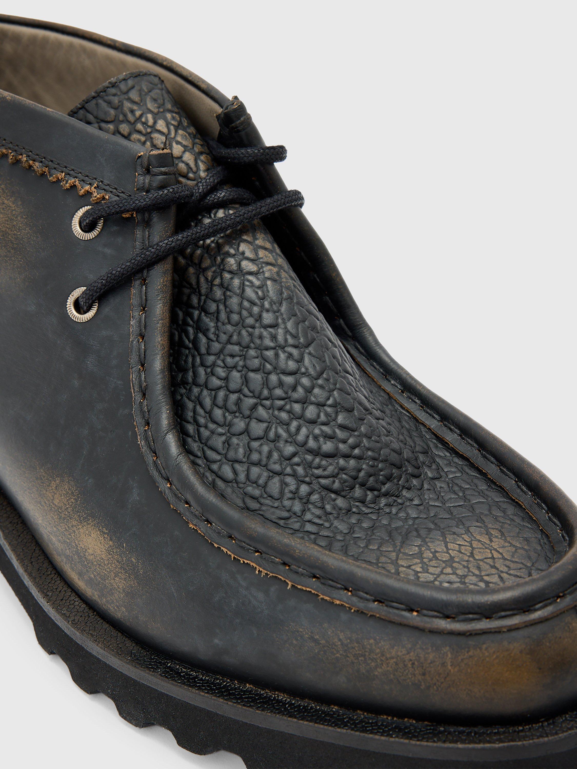 Product image 5 of 7, which shows AllSaints Skiff Leather Chukka Boots, Black/Multi, 10