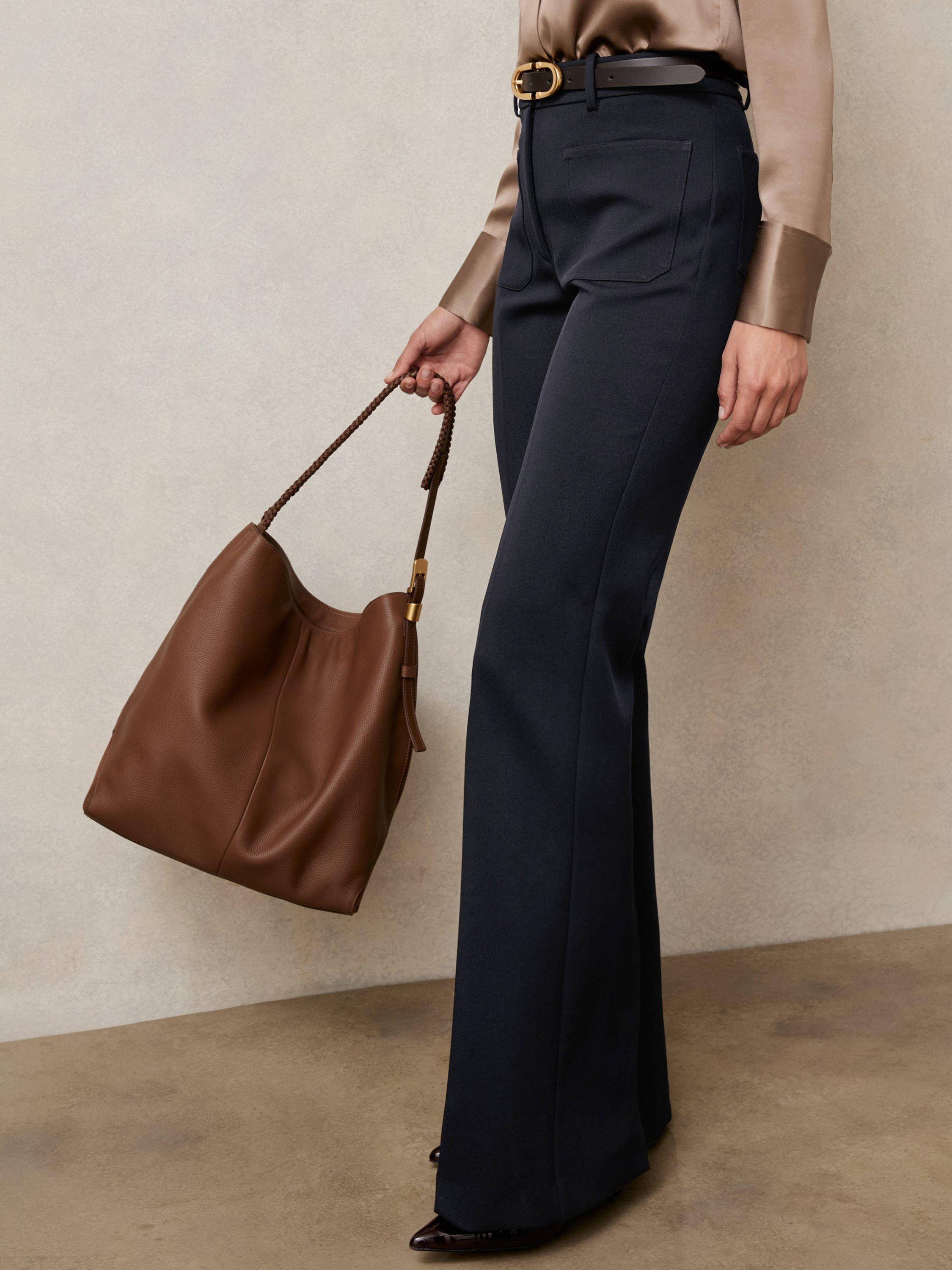 Product image 1 of 5, which shows Reiss Petite Priya Flared Trousers, Navy, 6Pt