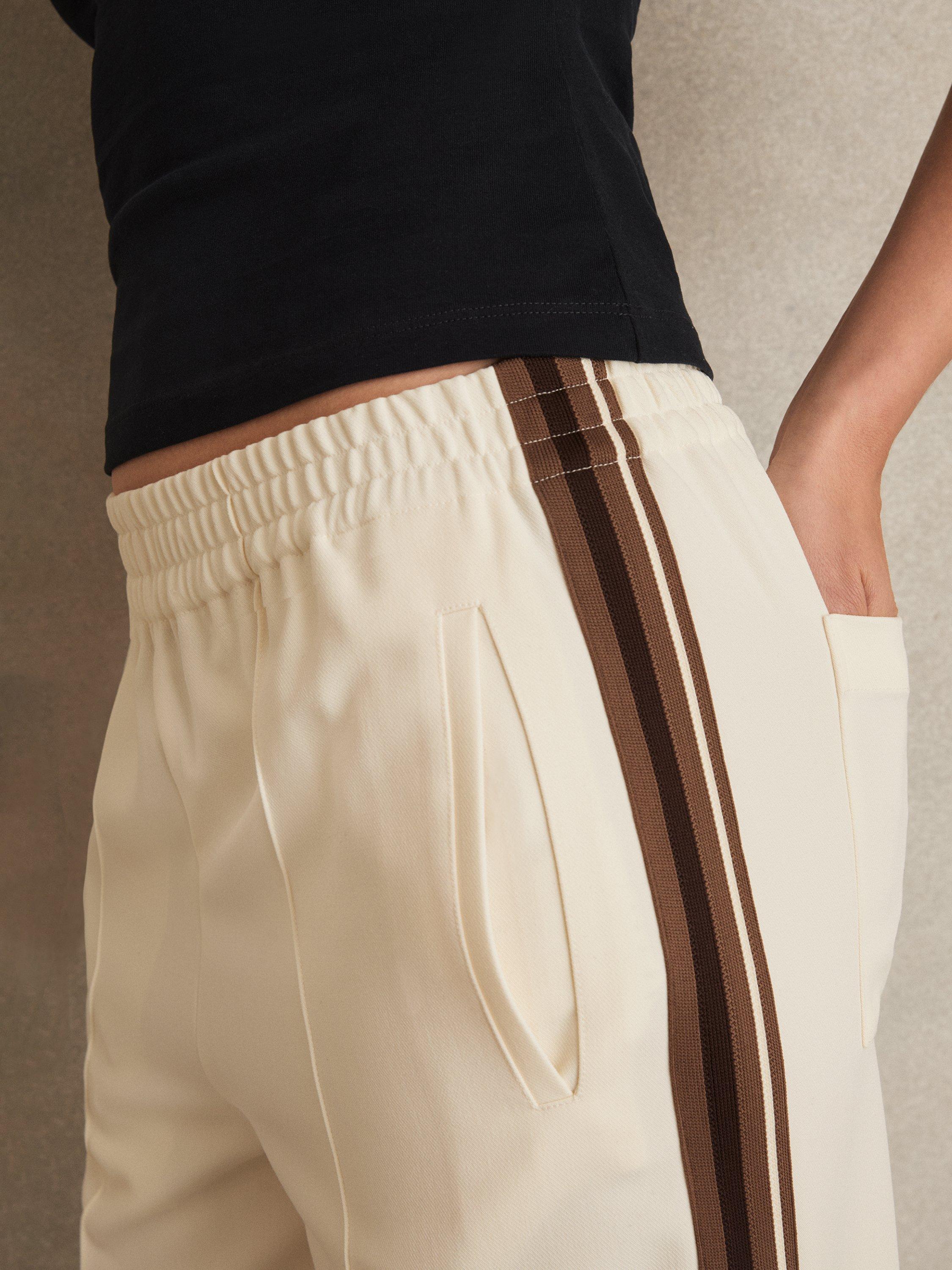 Product image 4 of 5, which shows Reiss Petite Robyn Side Stripe Trousers, Cream, 14Pt