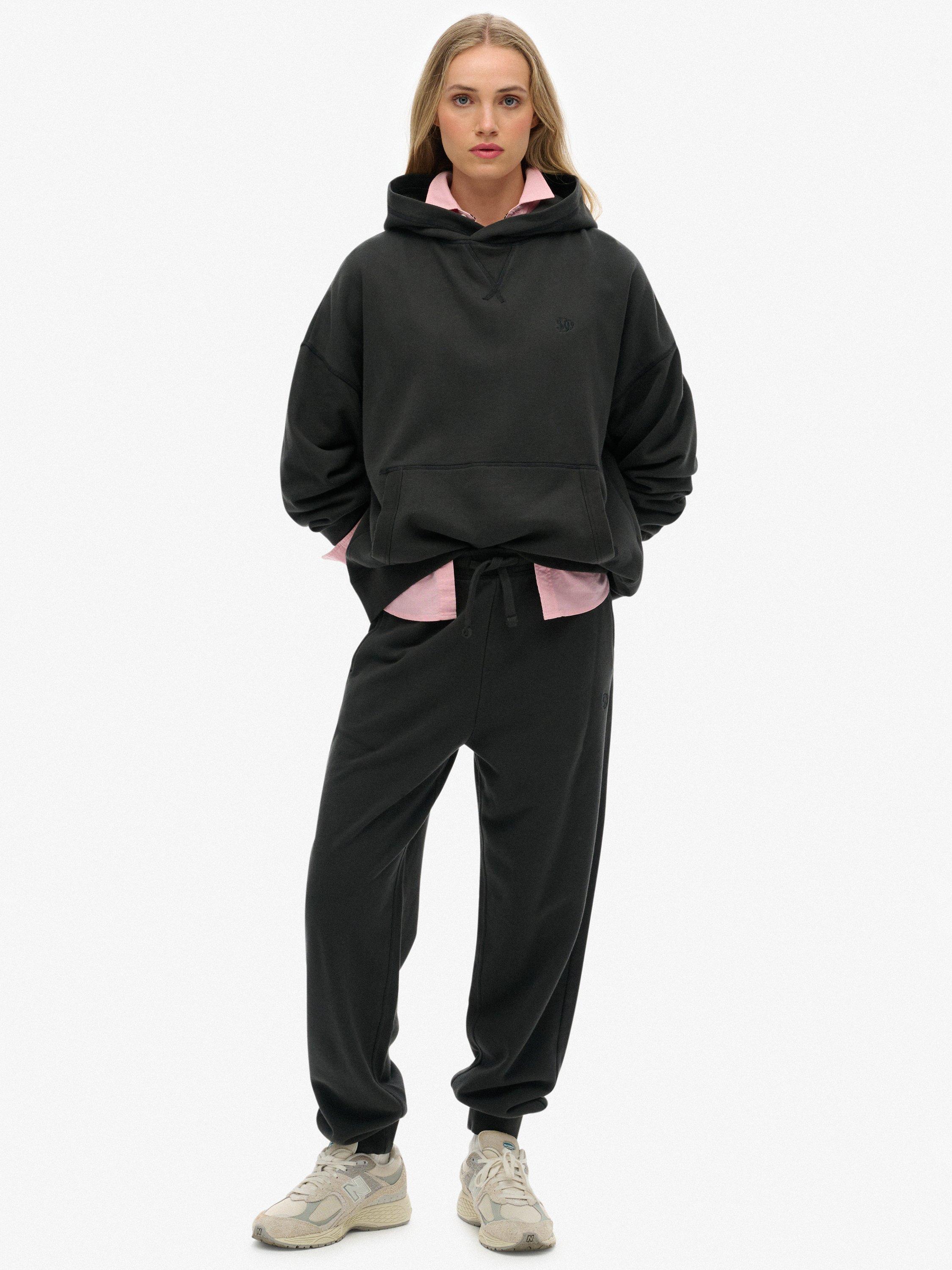 Product image 1 of 7, which shows Superdry Studios Cuffed Joggers, Washed Black, 14