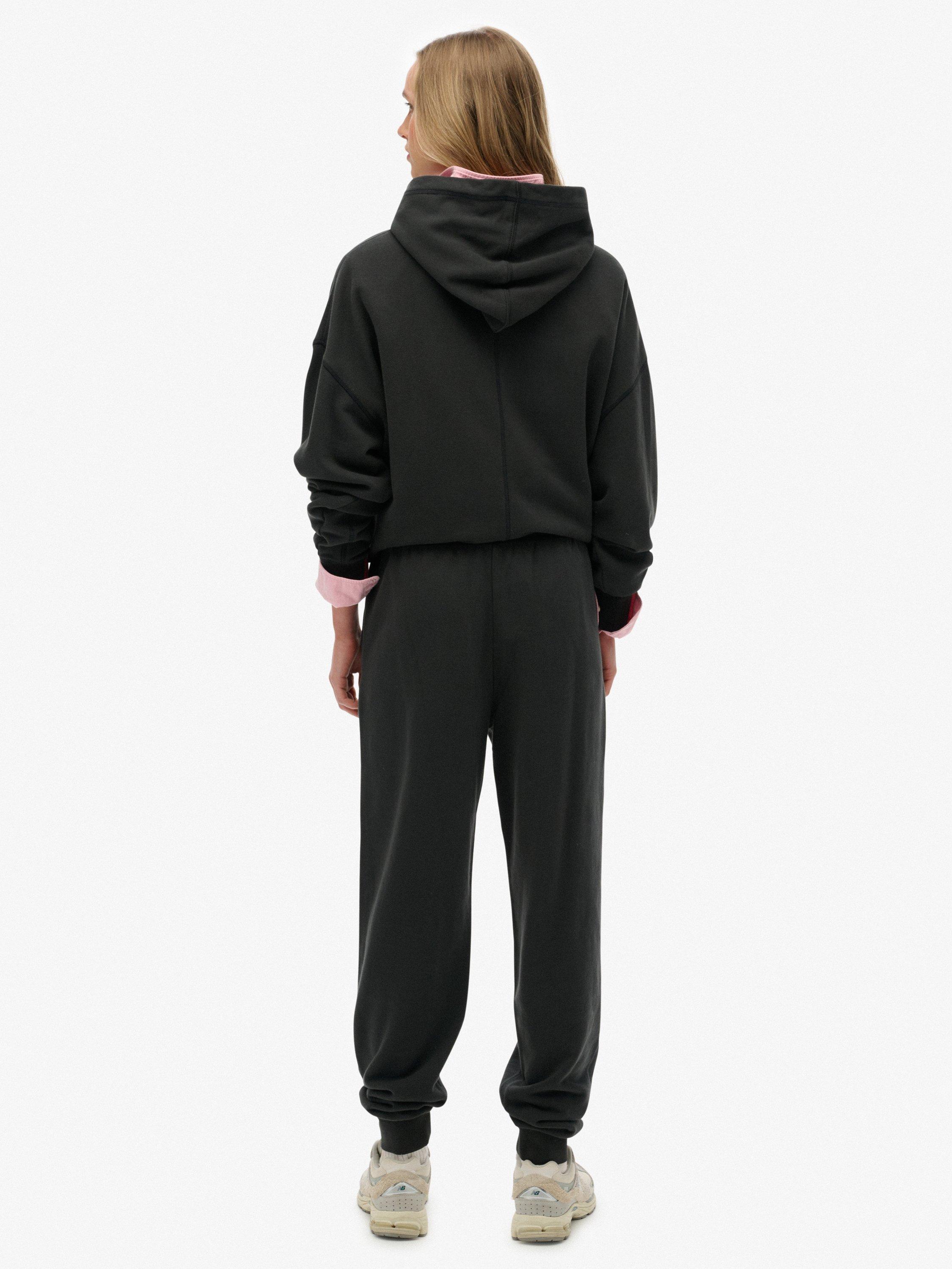 Product image 2 of 7, which shows Superdry Studios Cuffed Joggers, Washed Black, 14