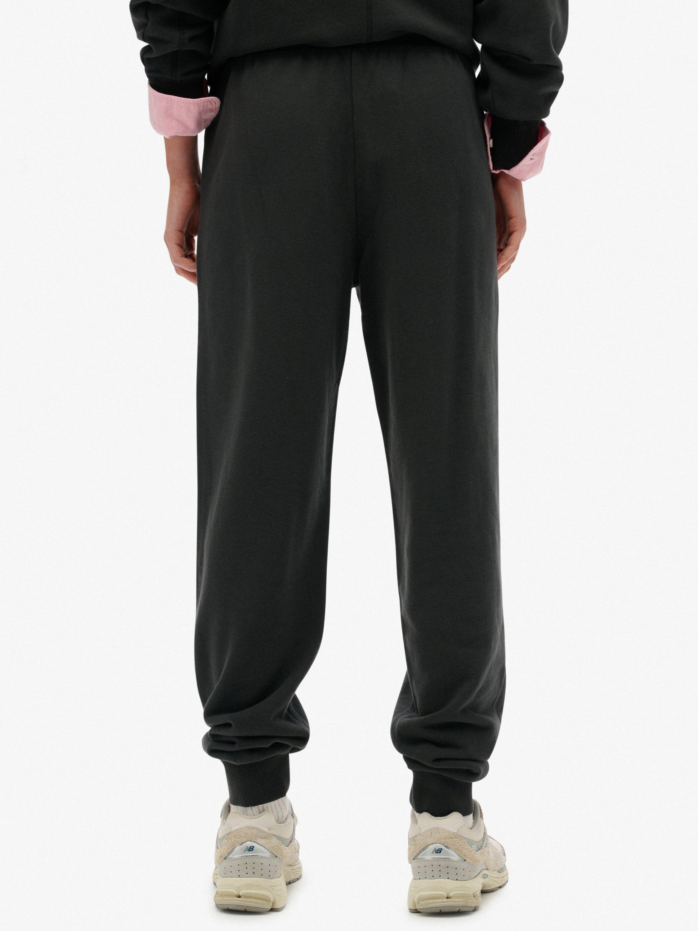 Product image 4 of 7, which shows Superdry Studios Cuffed Joggers, Washed Black, 14
