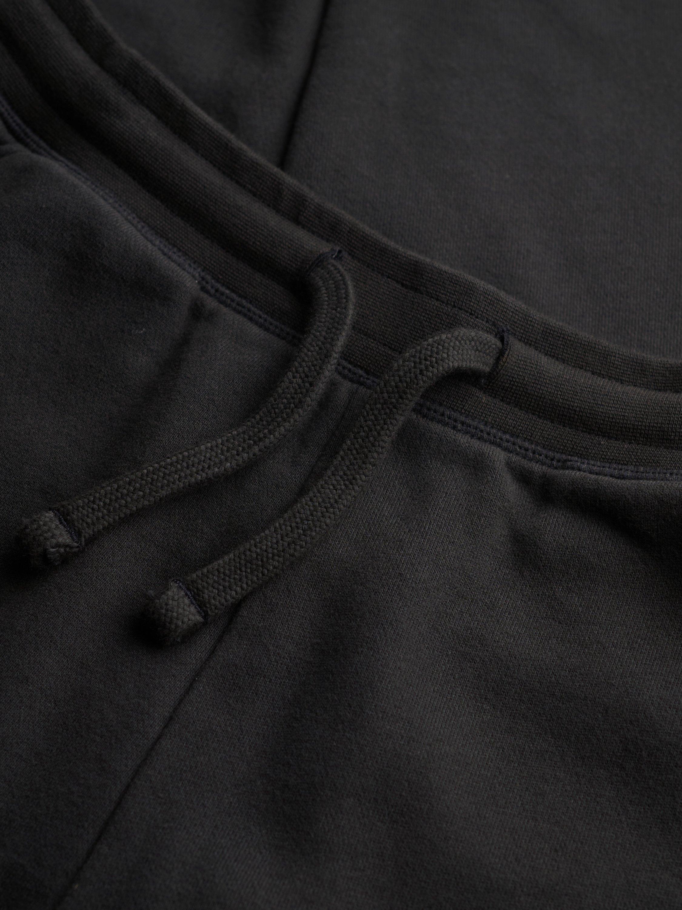 Product image 7 of 7, which shows Superdry Studios Cuffed Joggers, Washed Black, 14