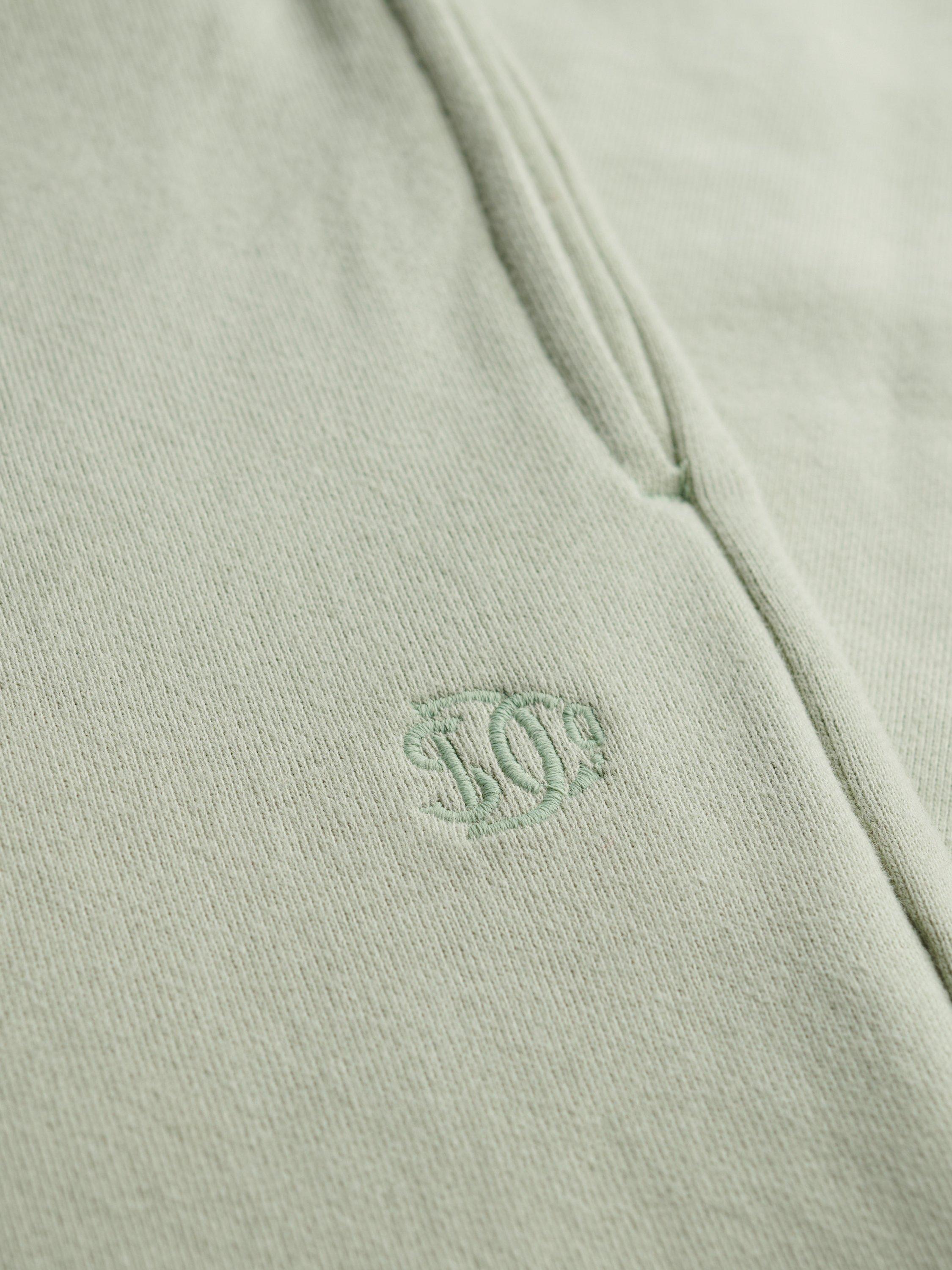 Product image 7 of 7, which shows Superdry Studios Cuffed Joggers, Dusty Sage, 12