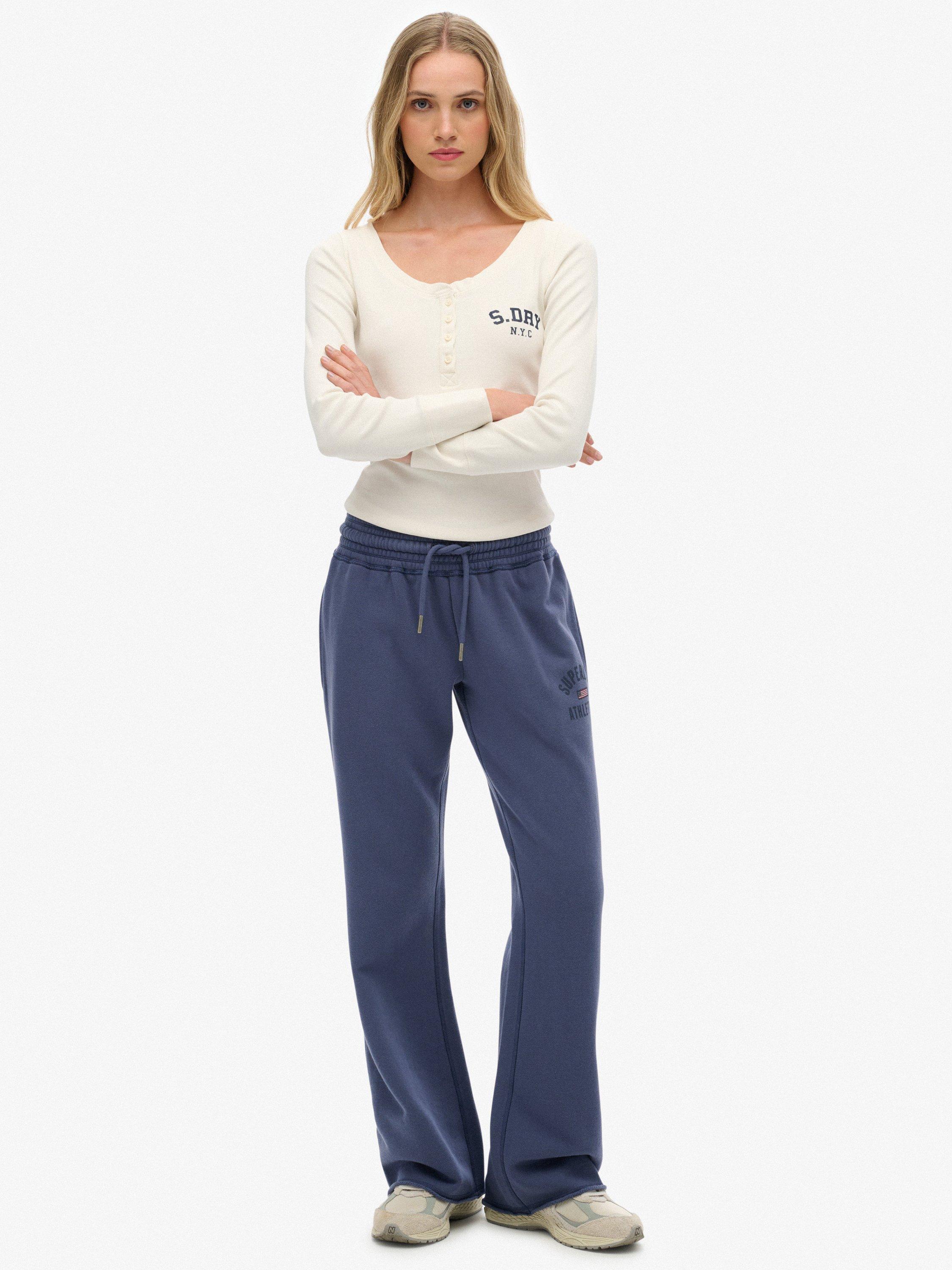 Product image 1 of 7, which shows Superdry Athletic Print Flare Joggers, Mariner Navy, 14