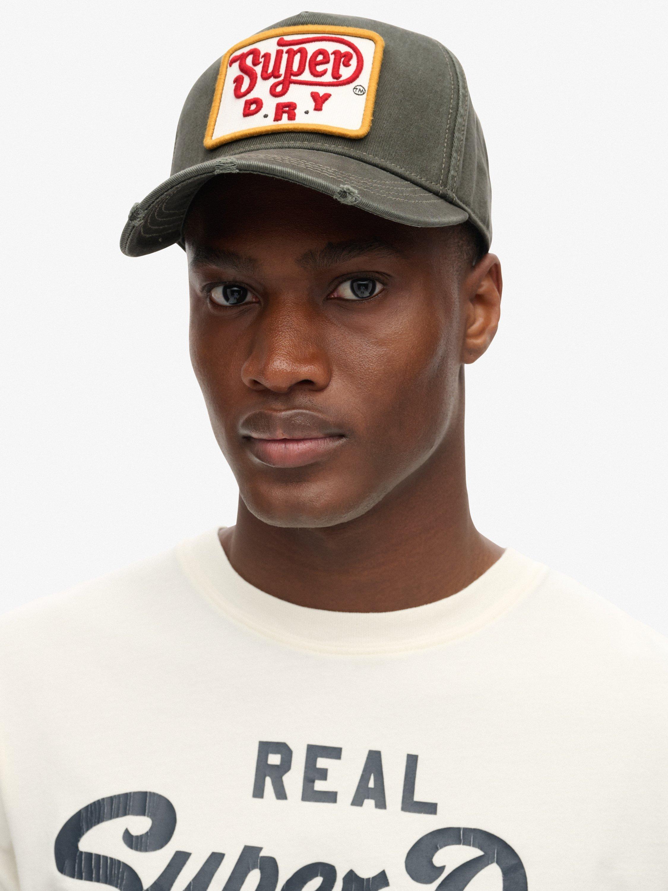 Product image 1 of 4, which shows Superdry Graphic Trucker Baseball Cap, Vintage Black, One Size