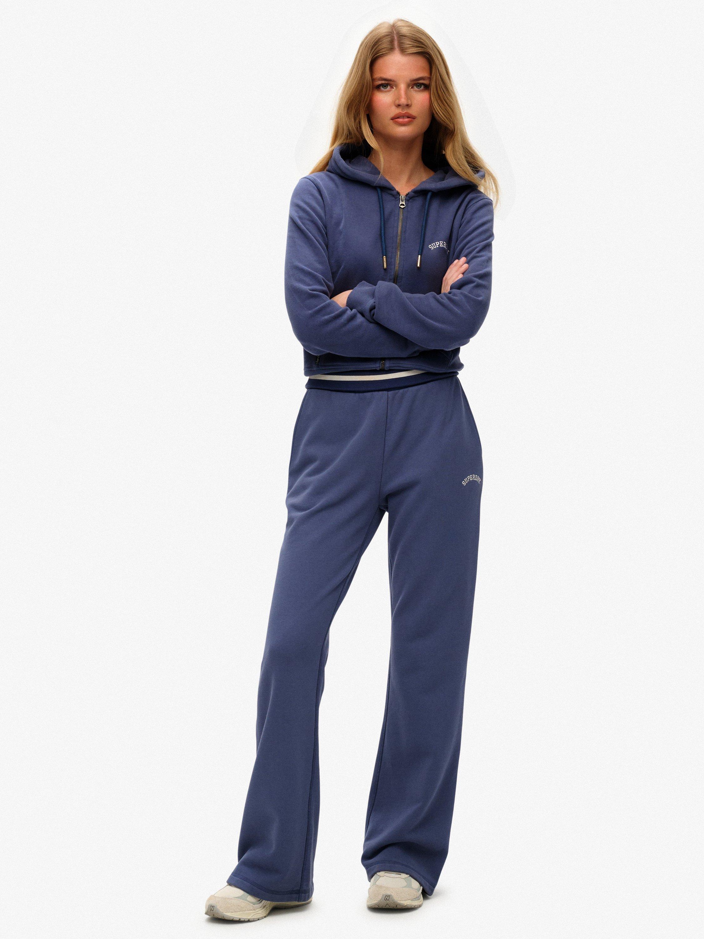 Product image 1 of 7, which shows Superdry Athletic Essentials Logo Low Rise Flare Joggers, Mariner Navy, 10