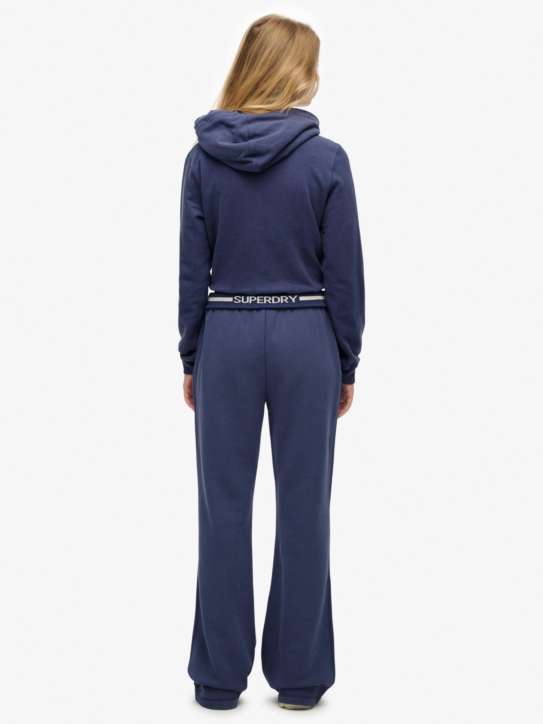 Product image 2 of 7, which shows Superdry Athletic Essentials Logo Low Rise Flare Joggers, Mariner Navy, 10