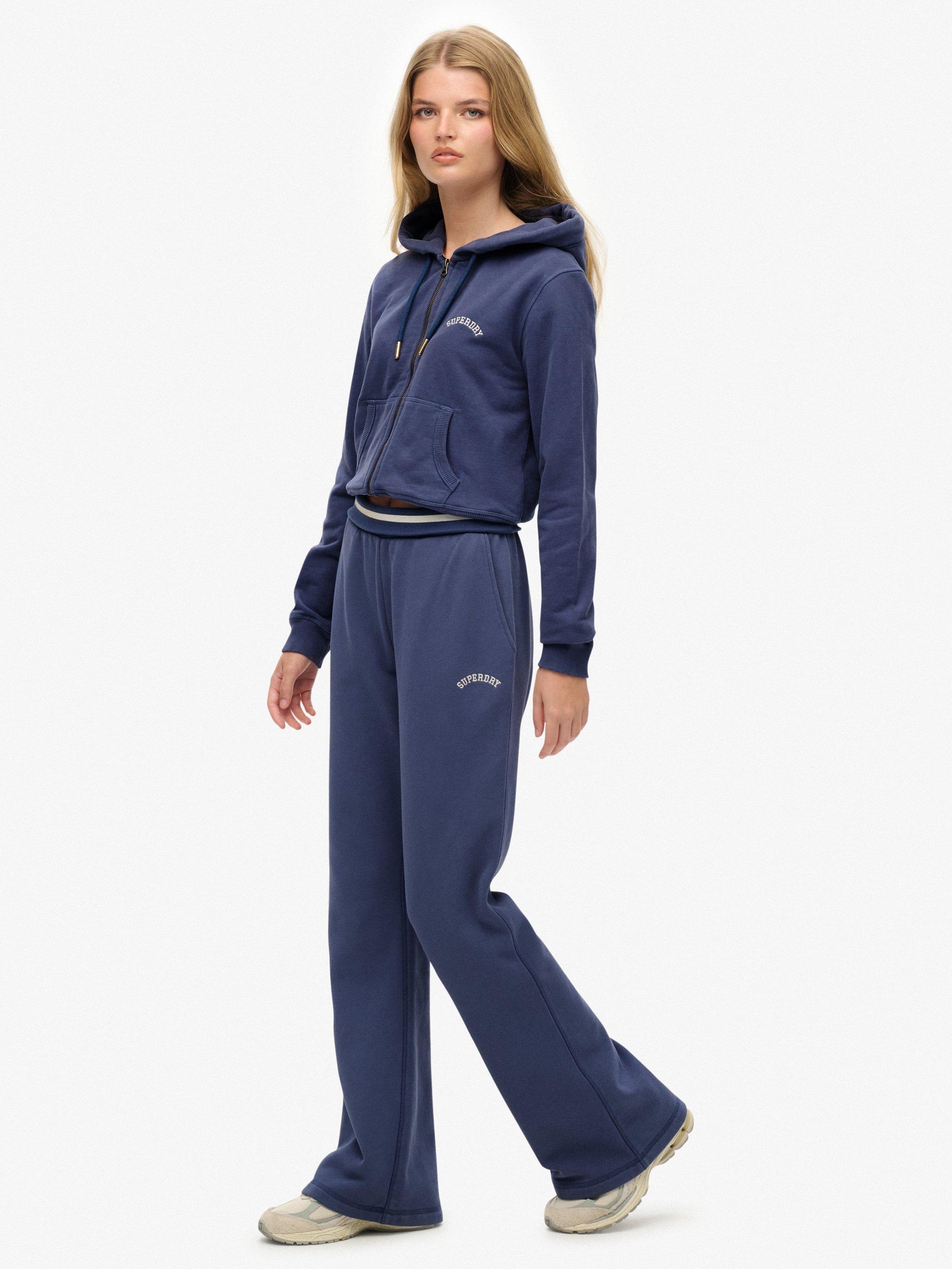 Product image 3 of 7, which shows Superdry Athletic Essentials Logo Low Rise Flare Joggers, Mariner Navy, 10