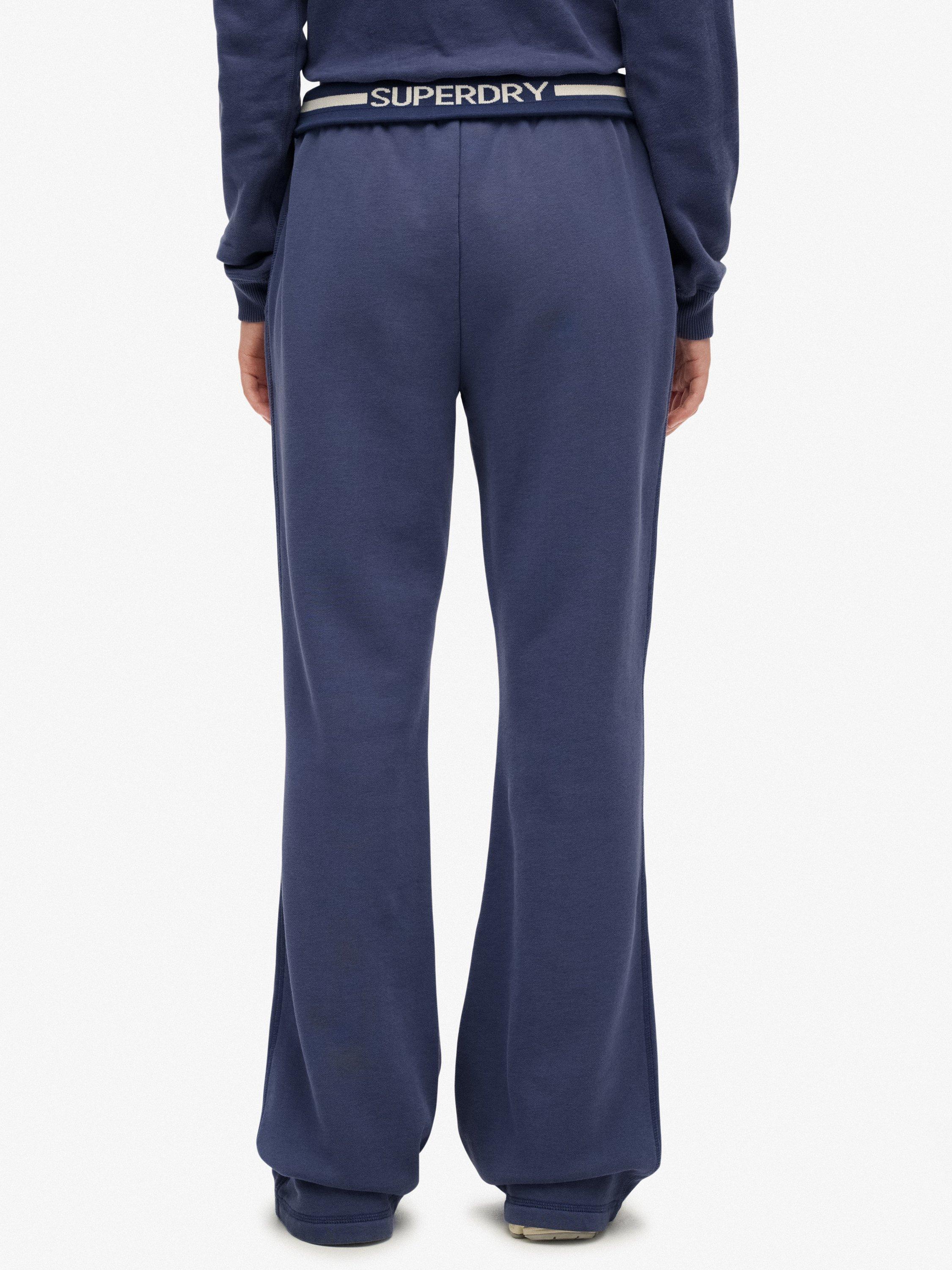 Product image 4 of 7, which shows Superdry Athletic Essentials Logo Low Rise Flare Joggers, Mariner Navy, 10
