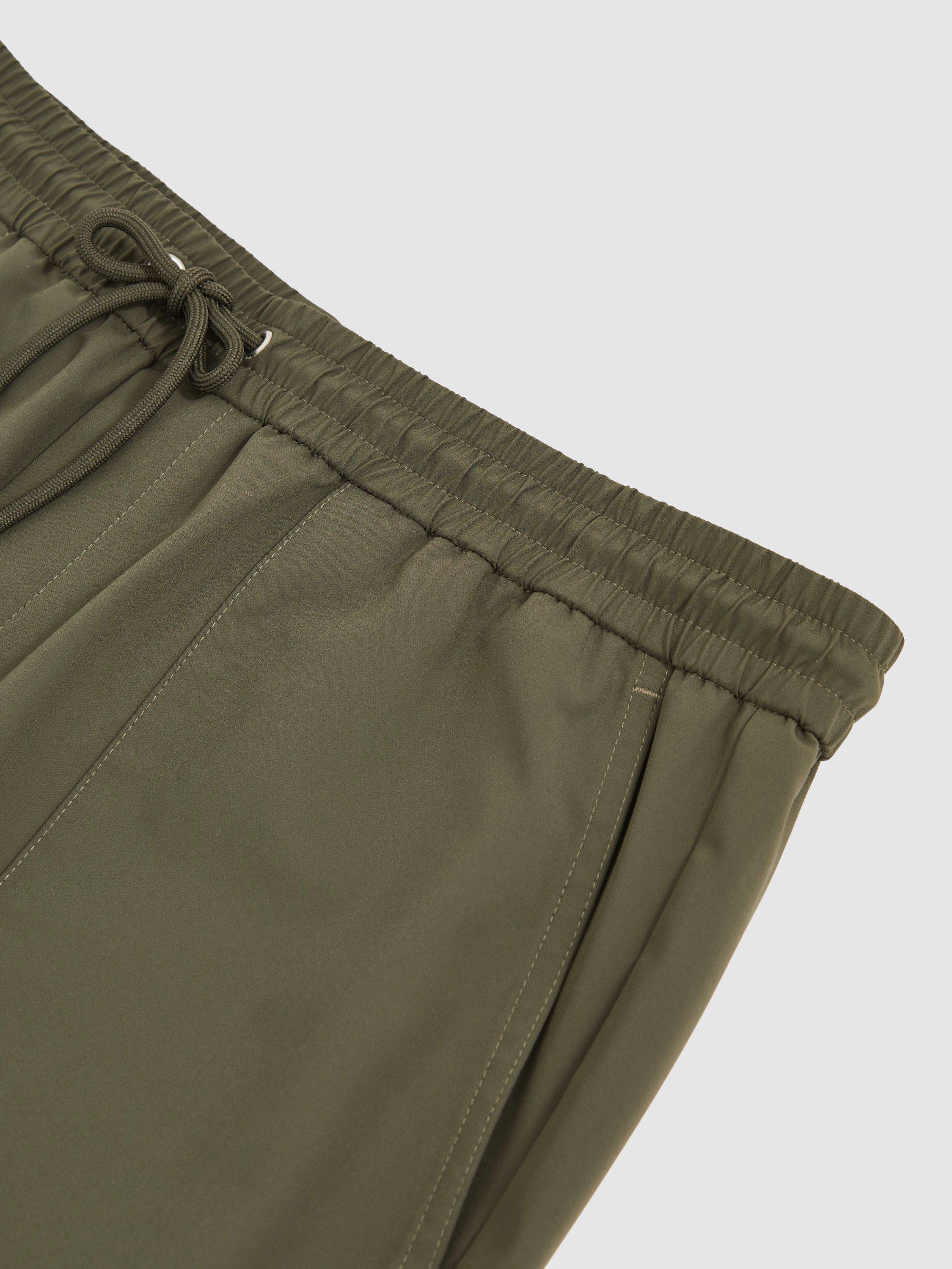 Product image 2 of 5, which shows Reiss Climb Tapered Joggers, Green, 28R