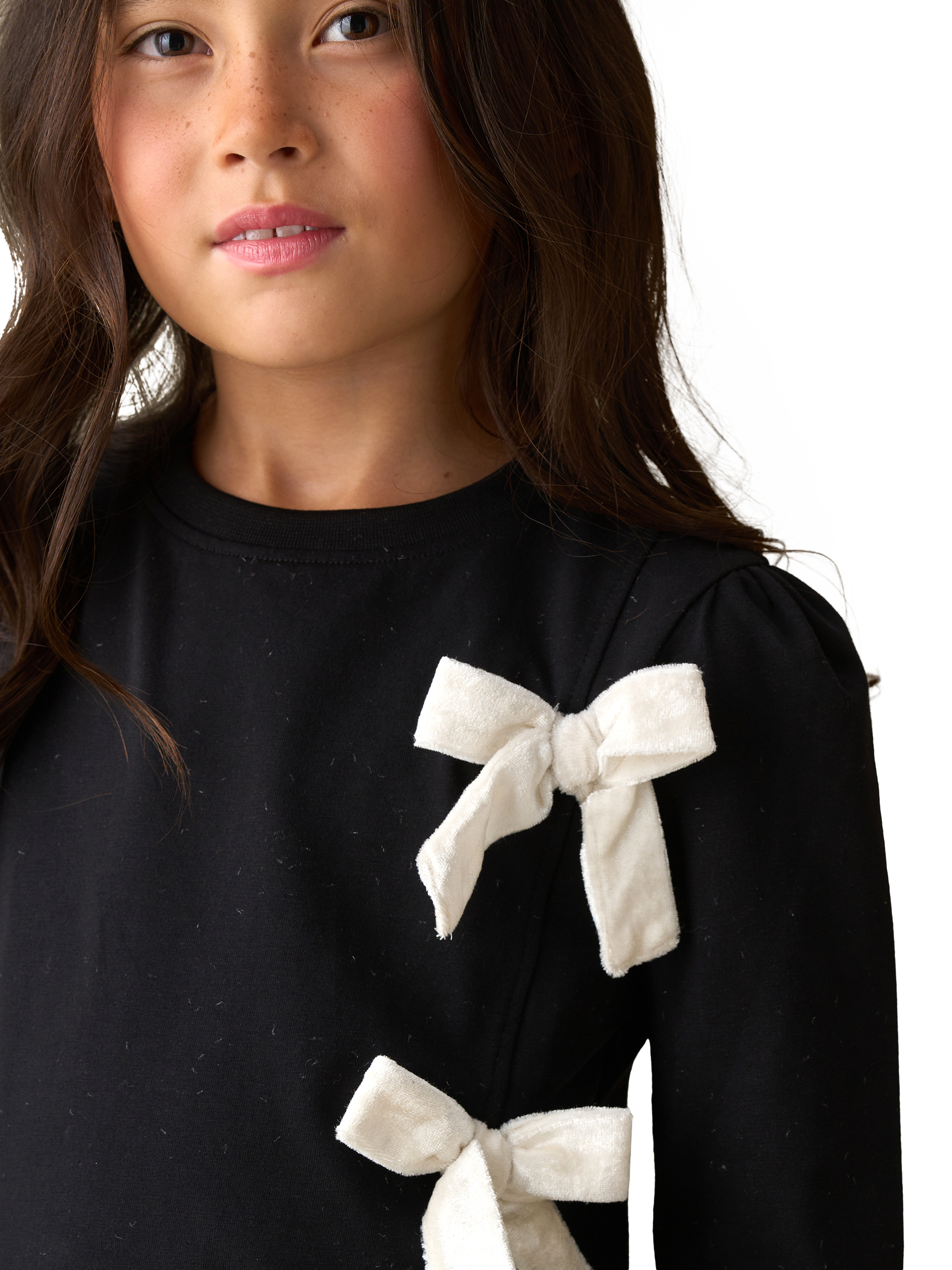 Product image 2 of 7, which shows Angel & Rocket  Kids' Cotton Blend Asymmetric Bow Top, Black, 3-4 years
