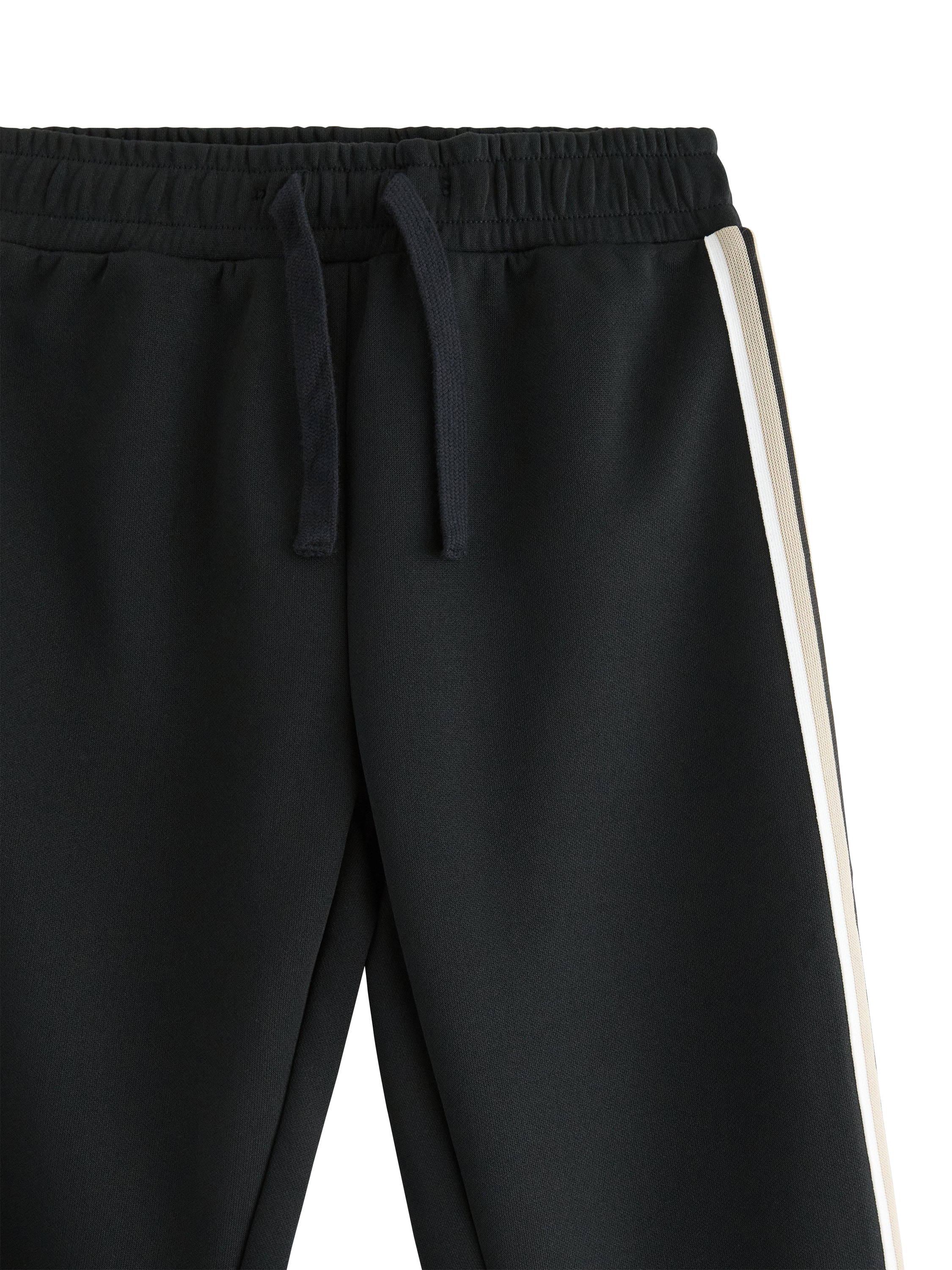 Product image 3 of 11, which shows Lindex Kids' Sporty Drawstring Joggers, Offblack, 2-3 years