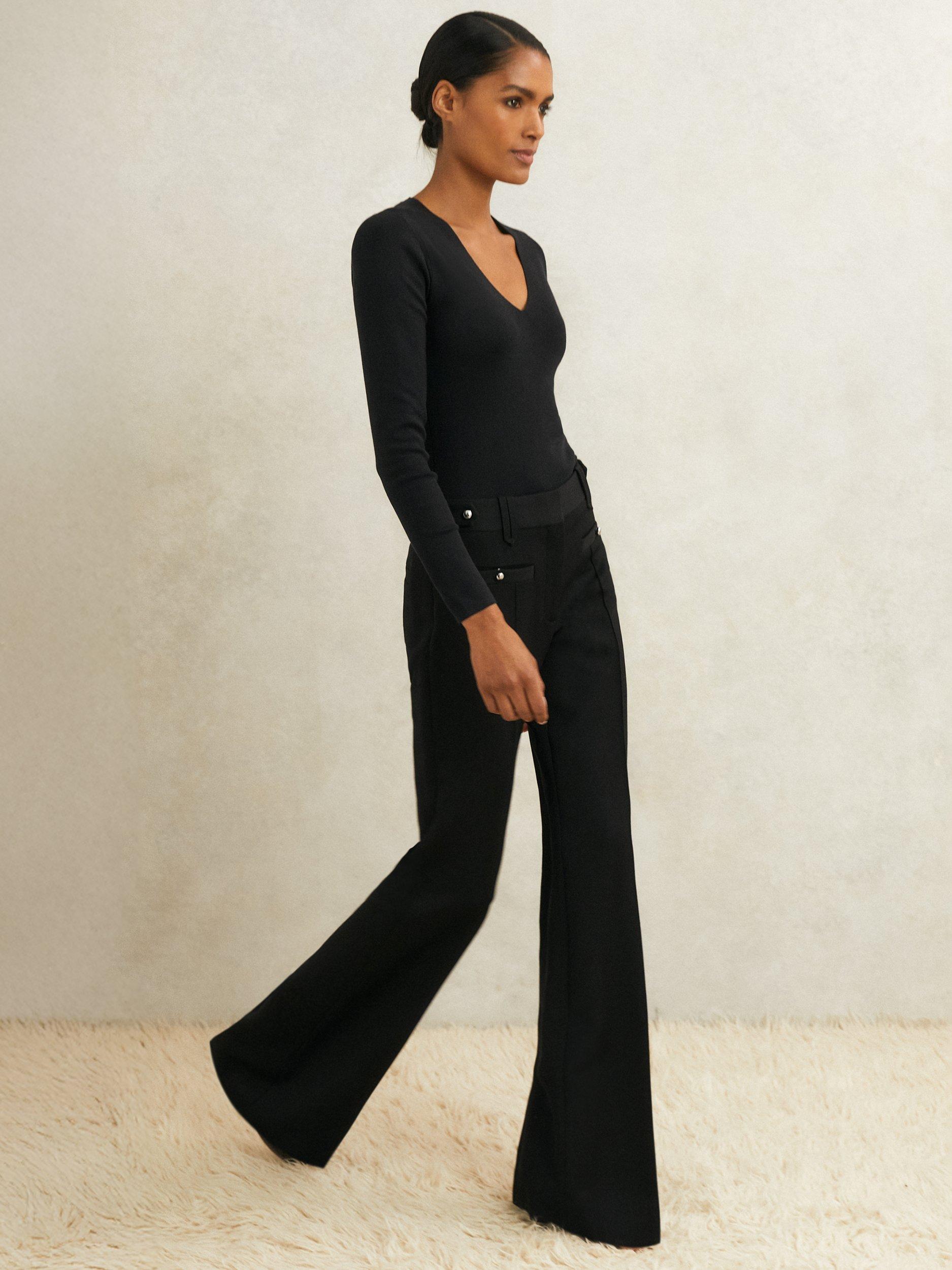 Product image 1 of 5, which shows Reiss Atelier Athena Stud Flared Pure Wool Trousers, Black, 6
