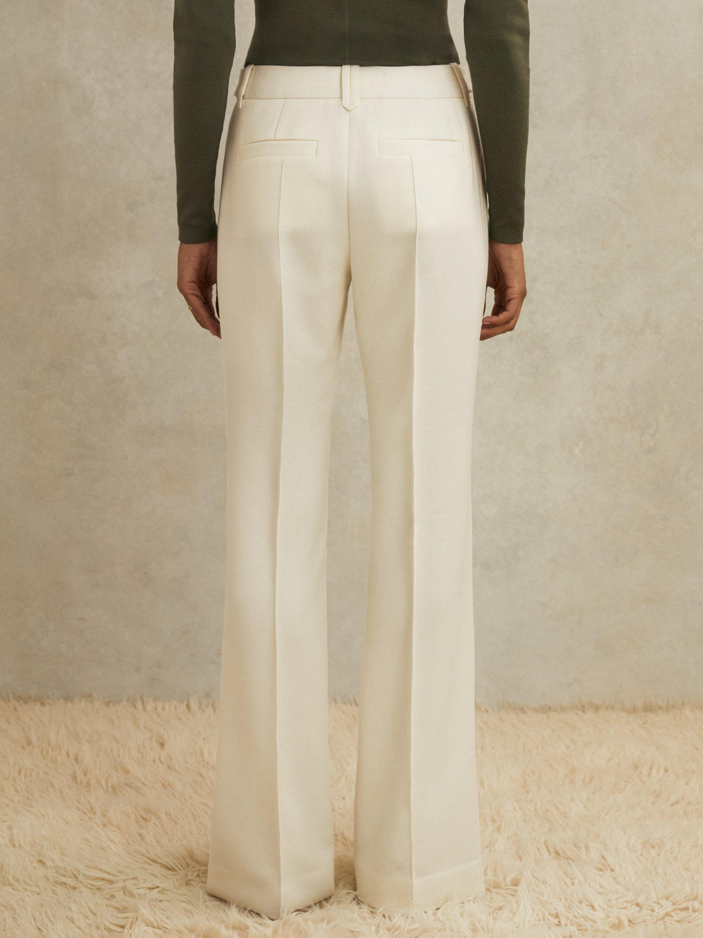 Product image 2 of 5, which shows Reiss Atelier Athena Stud Flared Pure Wool Trousers, White, 6