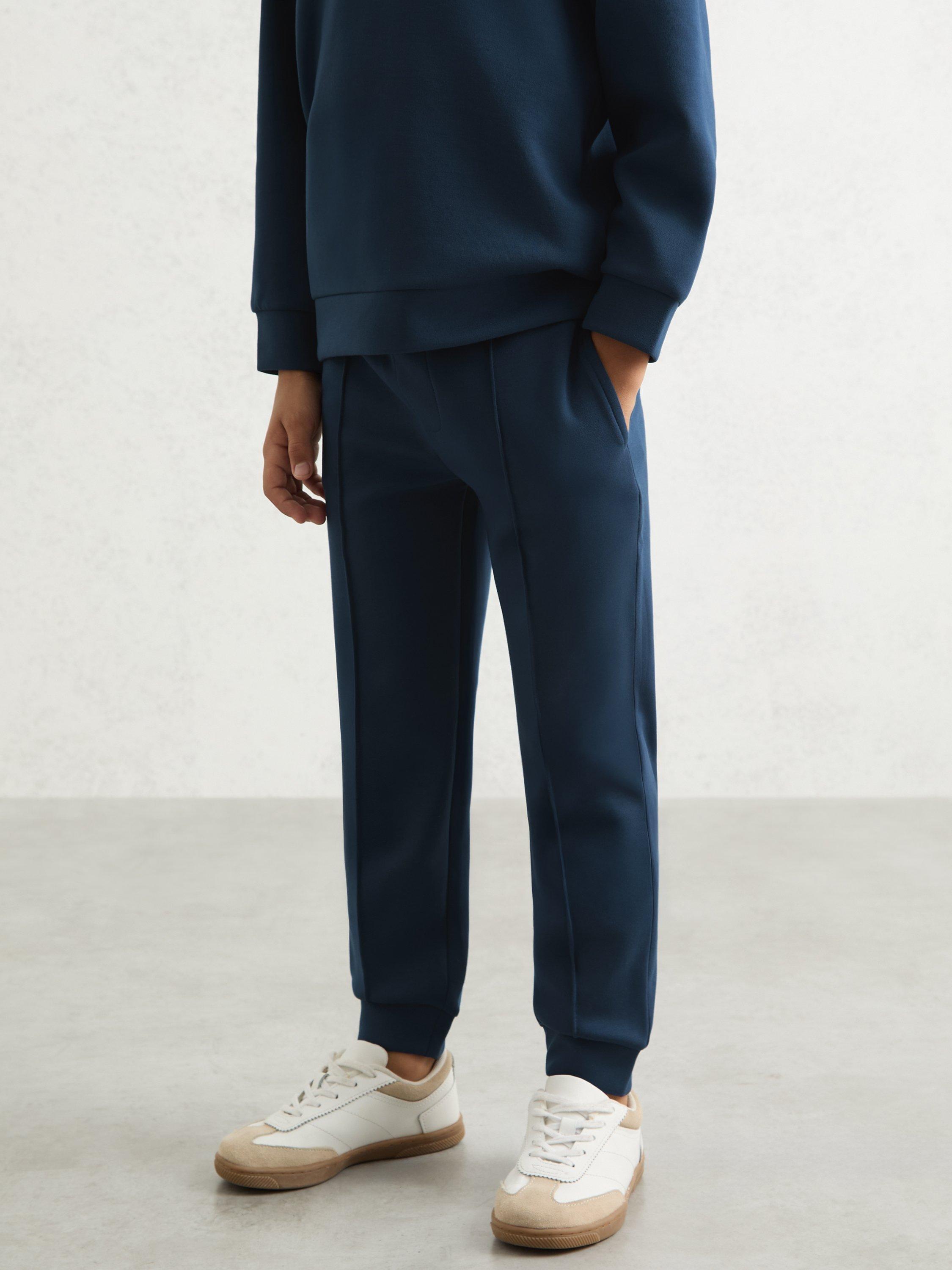 Product image 1 of 4, which shows Reiss Kids' Premier Drawstring Joggers, Ocean Blue, 4-5 years