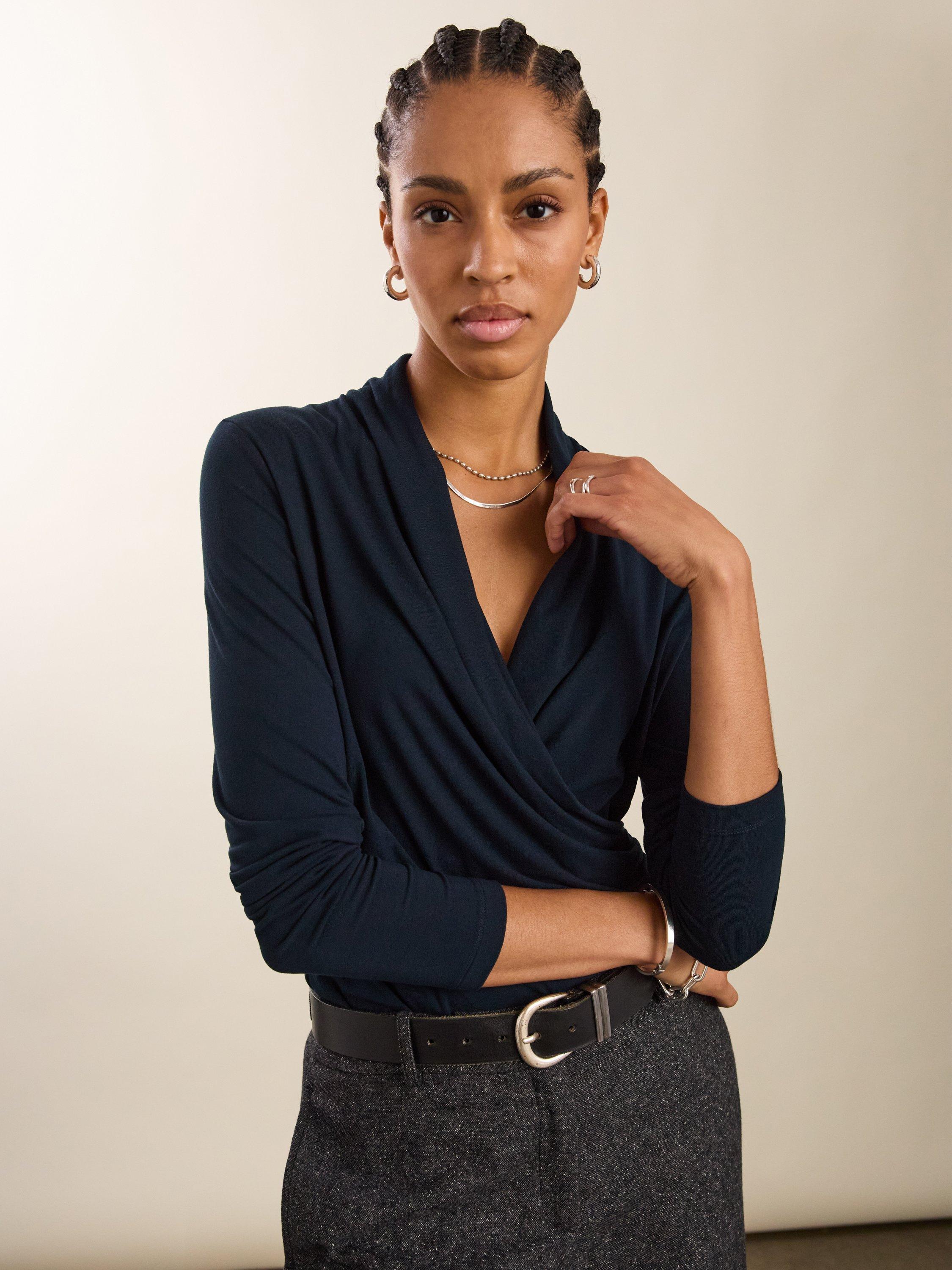 Product image 1 of 3, which shows Baukjen Gylda Wrap Top containing LENZING™ ECOVERO™ Viscose, Classic Navy, 10
