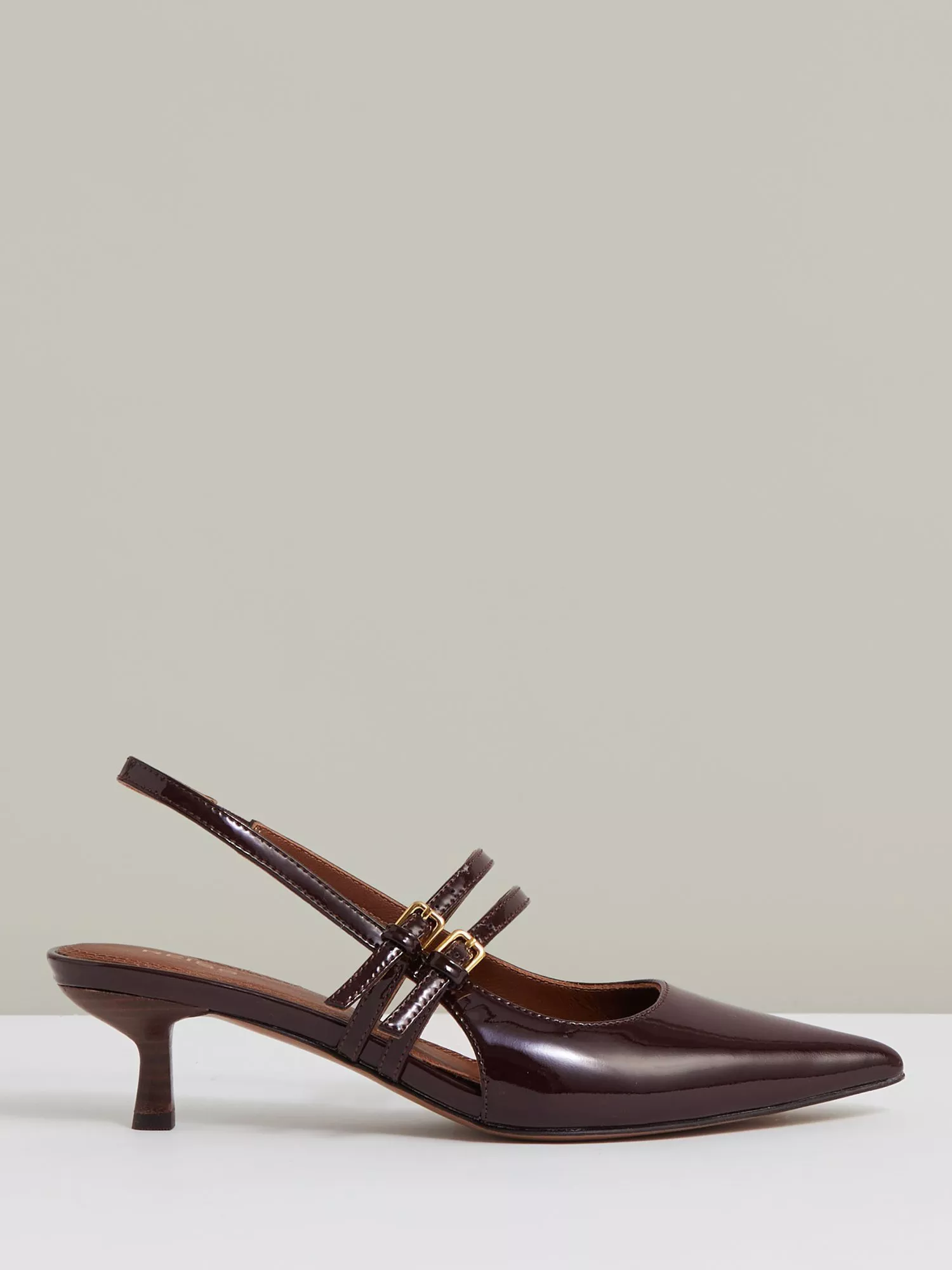 Woman wearing green shirred peplum top