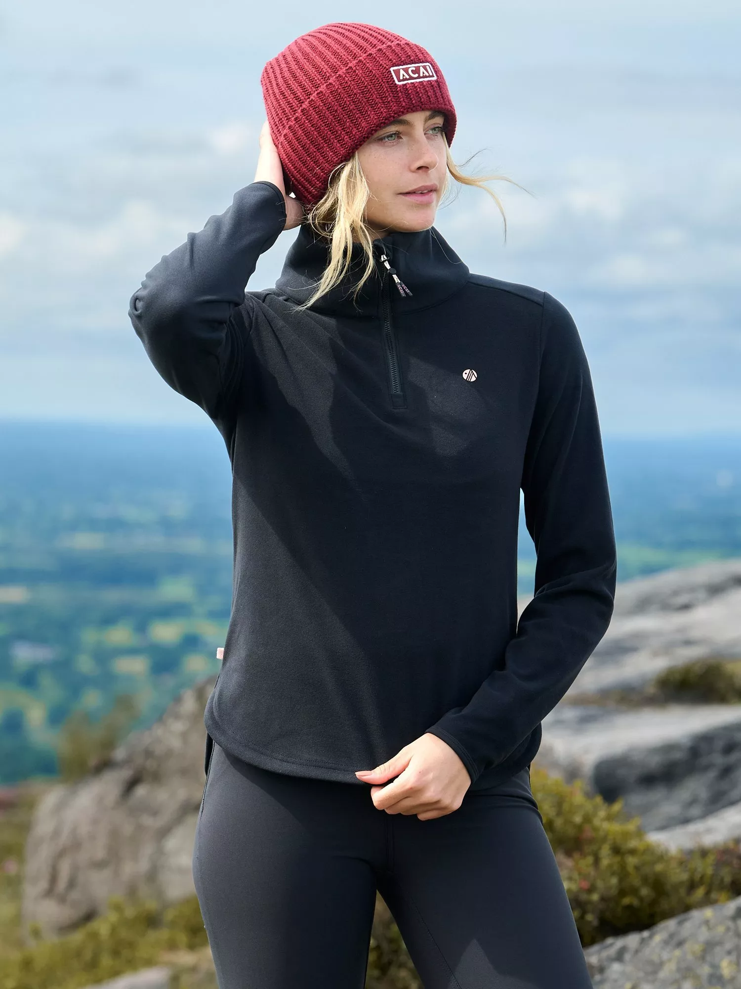 woman wearing a helly hansen brand hat and coat