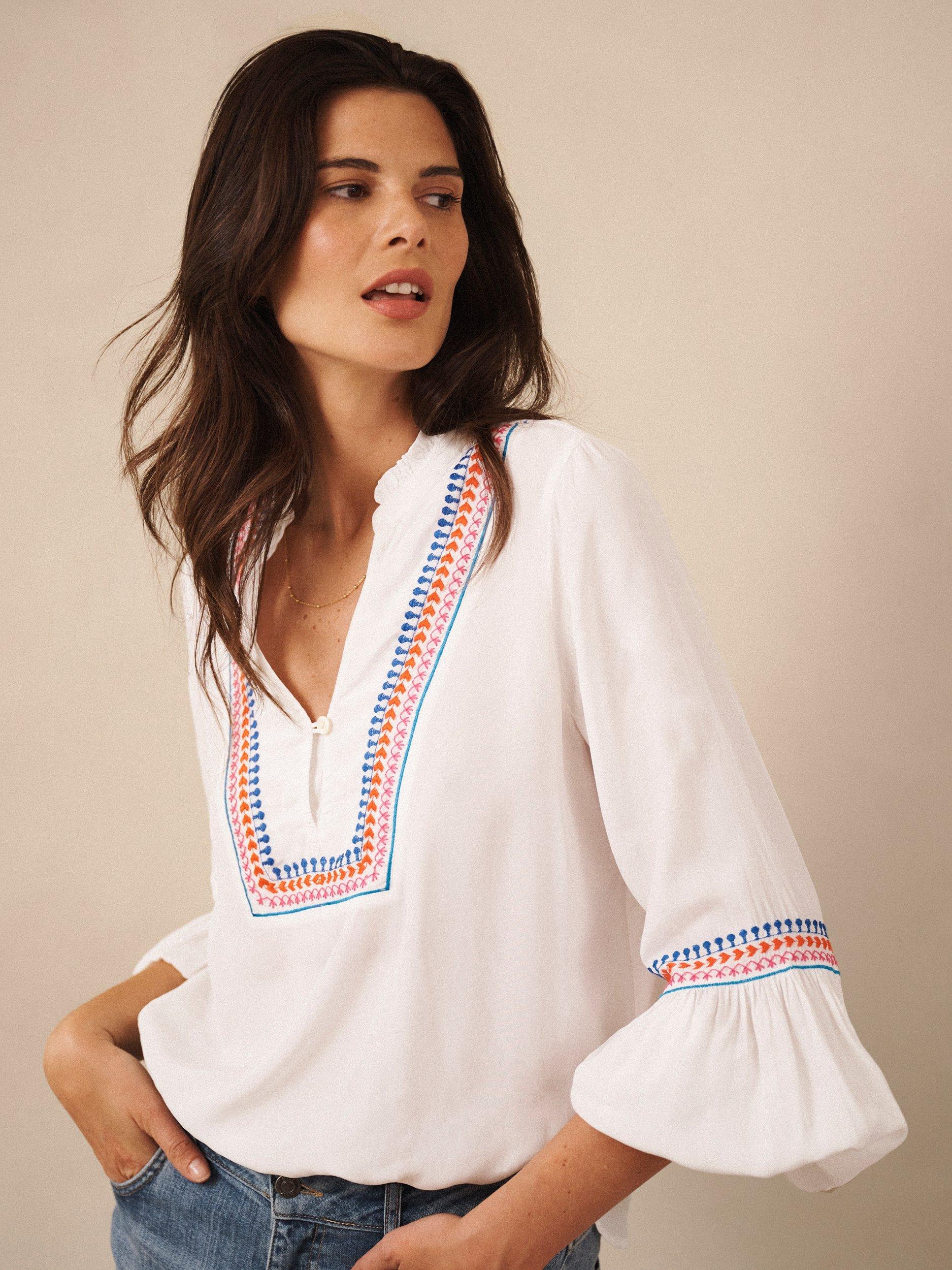 Product image 6 of 8, which shows NRBY Vaila Embroidered Long Sleeve V Neck Blouse, White, XS