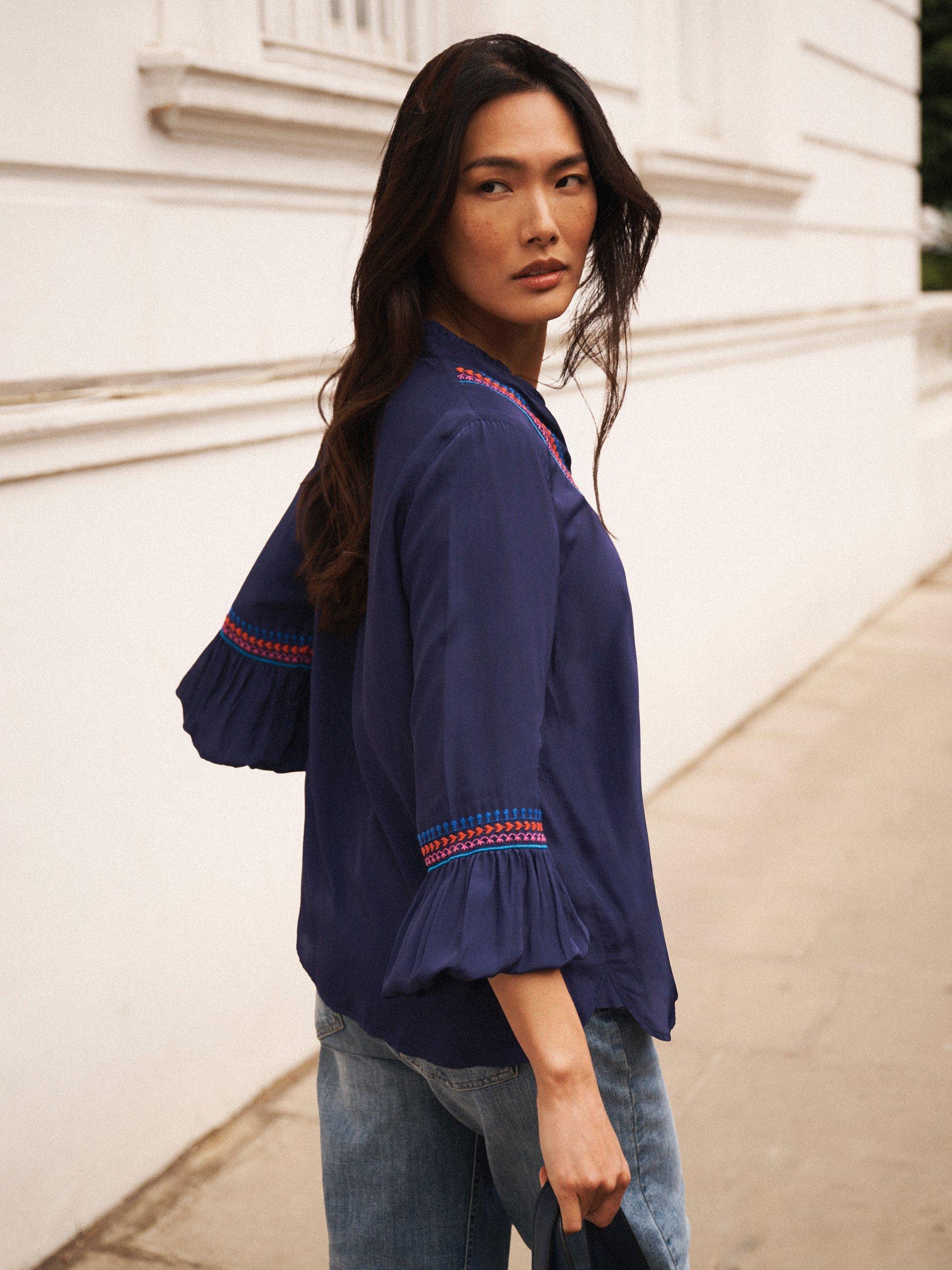 Product image 5 of 8, which shows NRBY Vaila Embroidered Long Sleeve V Neck Blouse, Navy, XS