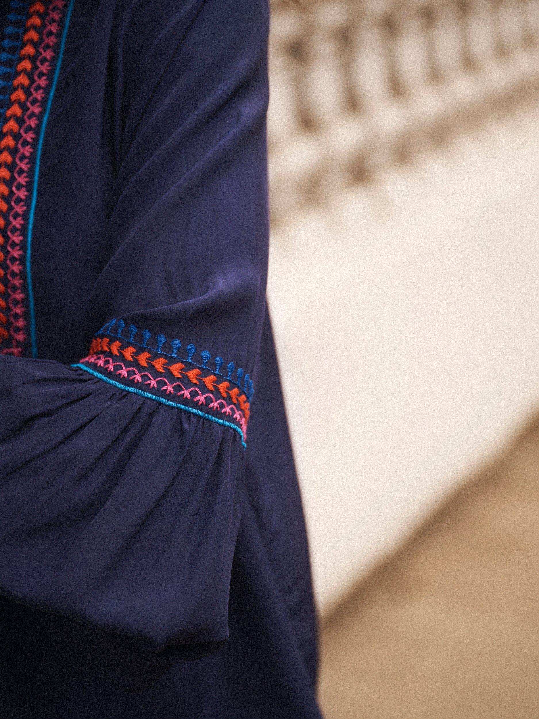 Product image 8 of 8, which shows NRBY Vaila Embroidered Long Sleeve V Neck Blouse, Navy, XS