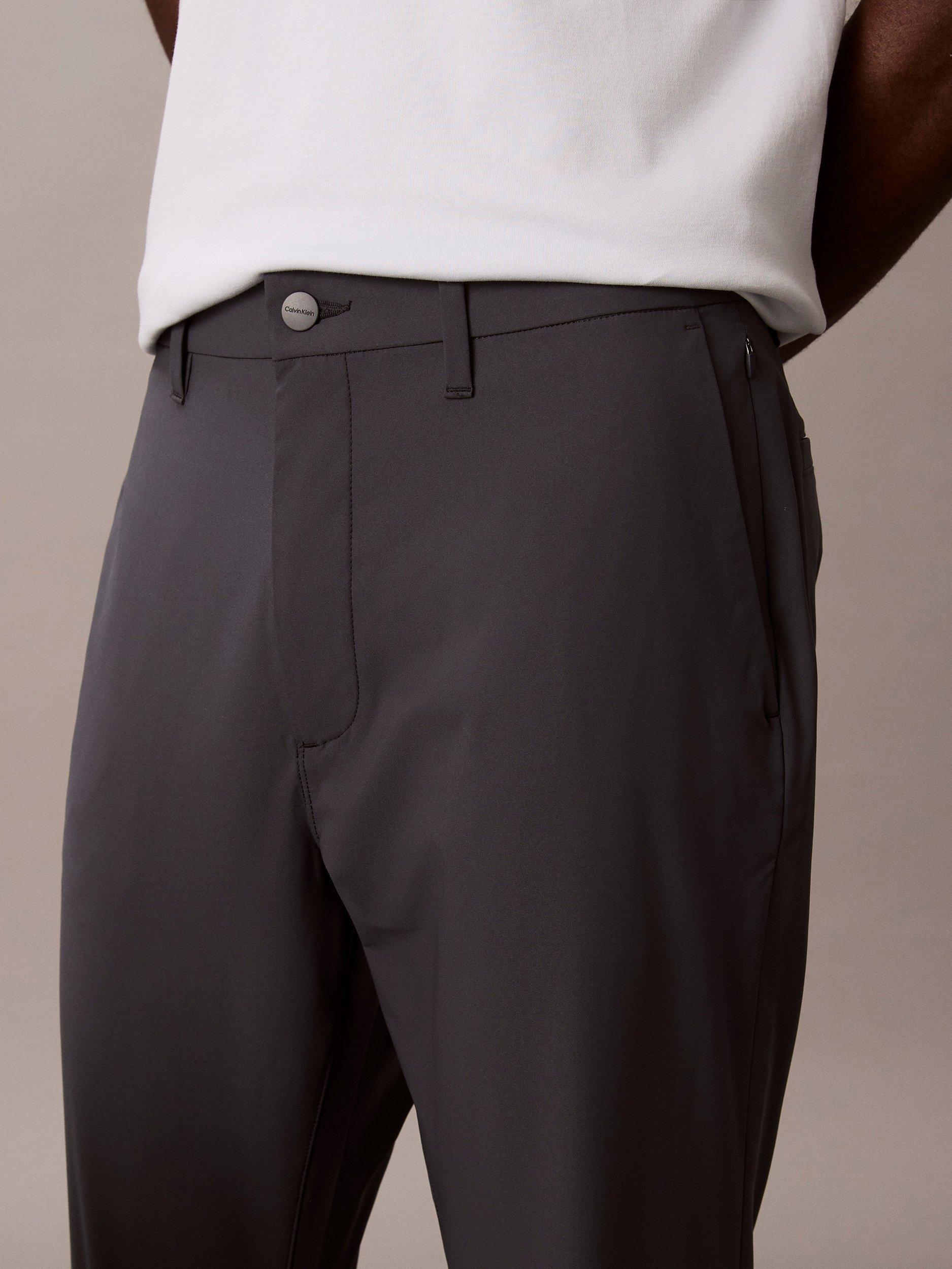 Product image 4 of 6, which shows Calvin Klein Slim Tech Stretch Trousers, India Ink, 29R