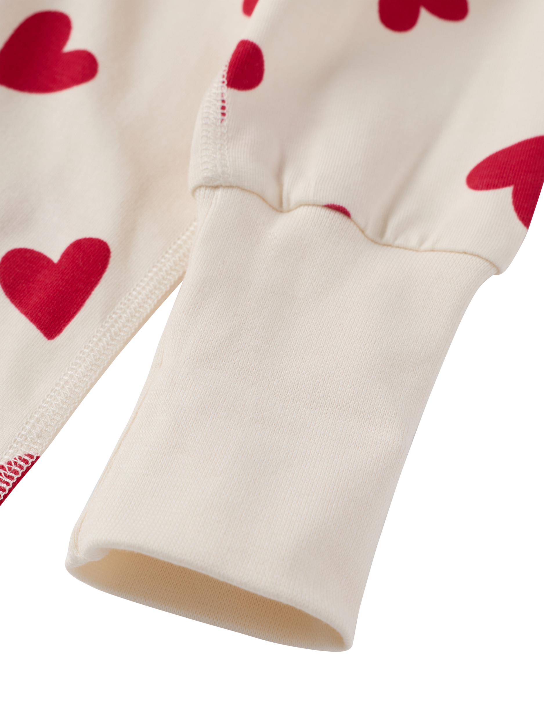 Product image 2 of 3, which shows Polarn O. Pyret Baby Cotton Blend Heart Print Sleepsuit, White/Red, 0-2 months