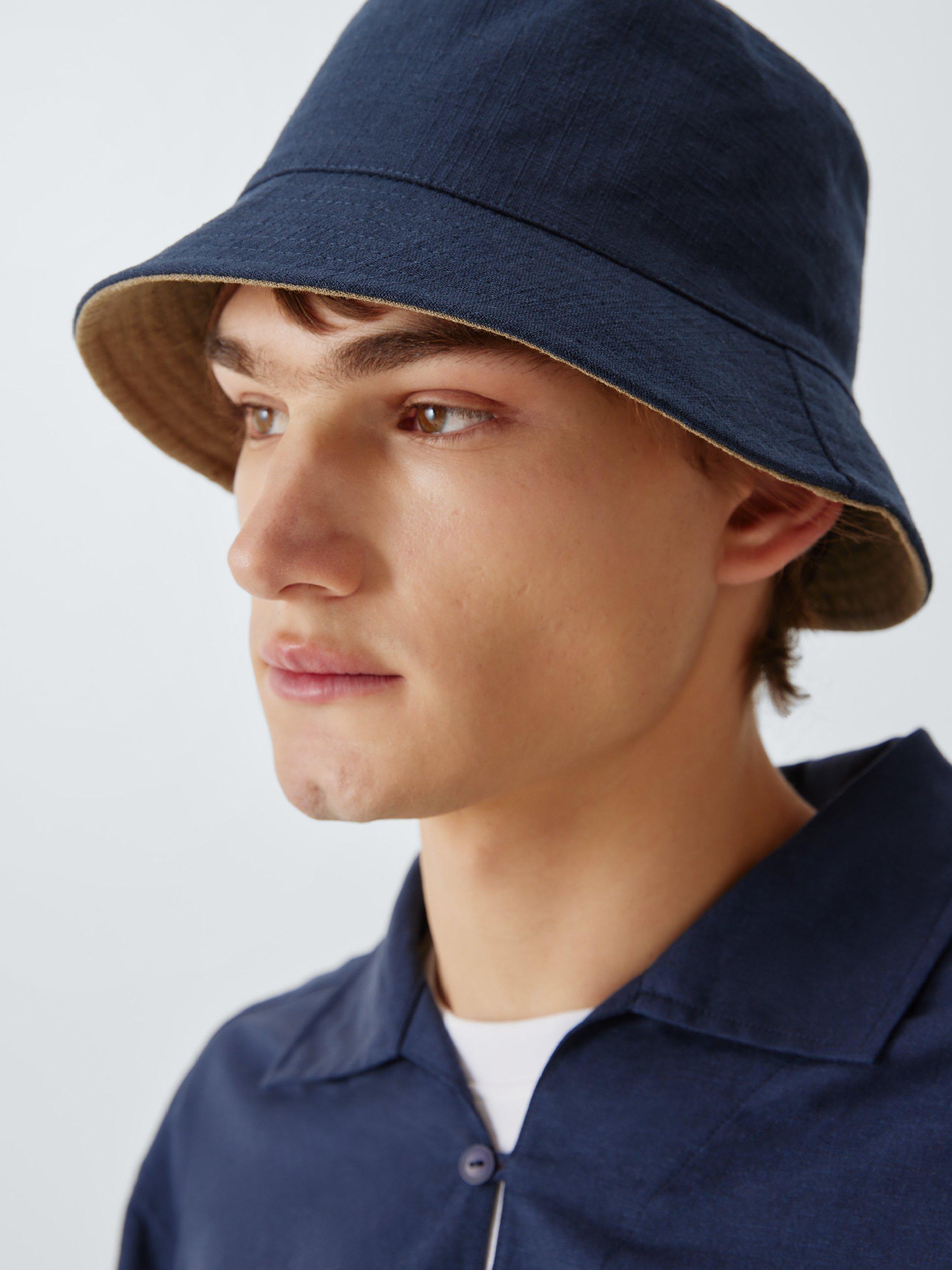 Product image 1 of 4, which shows John Lewis Reversible Bucket Hat, Navy/Stone, S-M