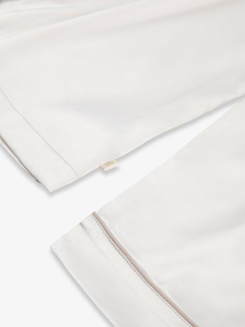 Product image 10 of 11, which shows The Little Tailor Kids' Satin Pyjama Set, Cream, 2-3 years