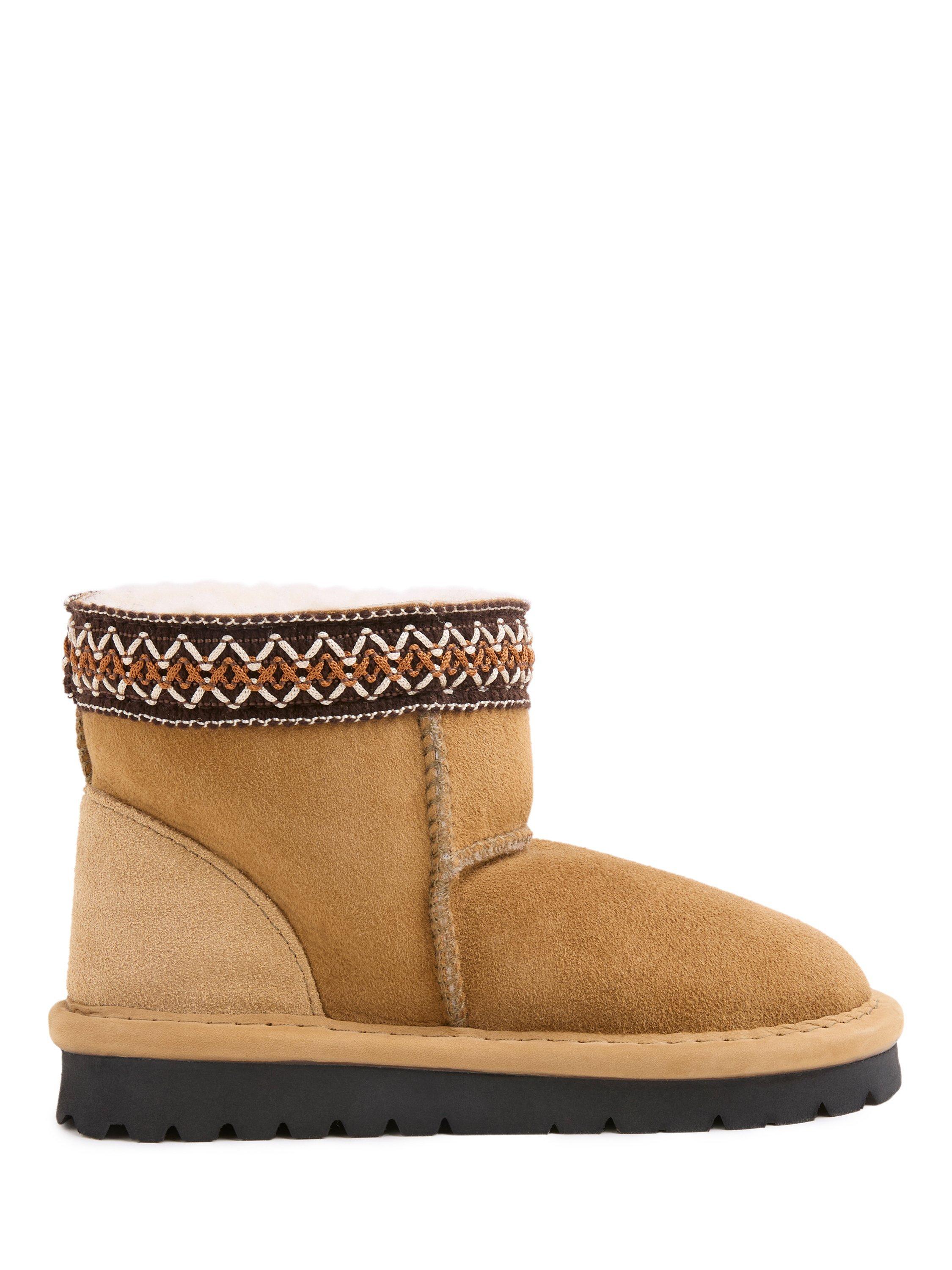 Product image 1 of 6, which shows Celtic & Co. Kids' Sheepskin Braid Trim Slipper Boots, Spice, 5-6 years