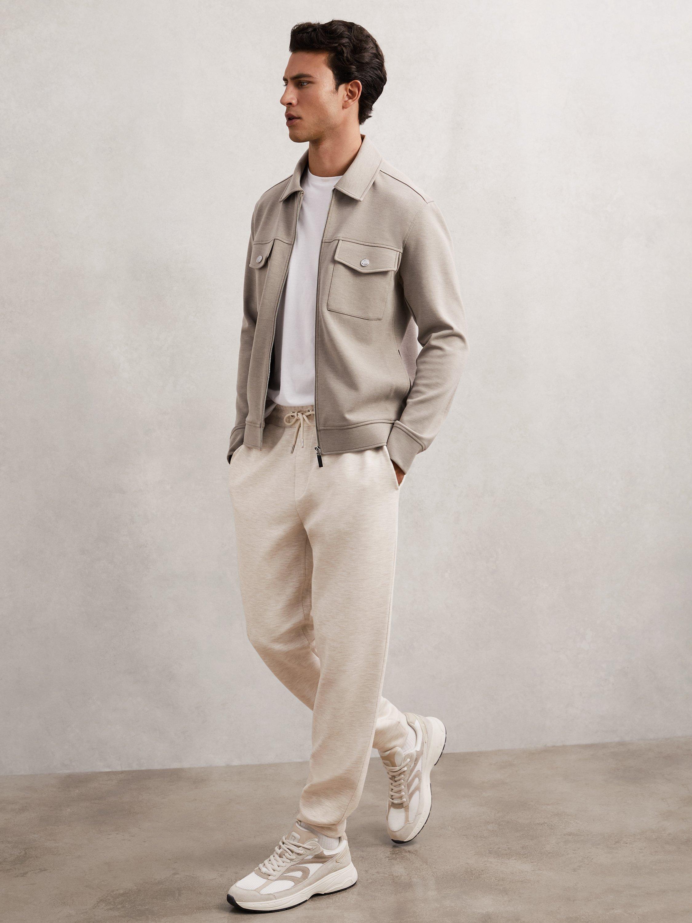 Product image 1 of 5, which shows Reiss Bell Jersey Drawstring Cuffed Joggers, Oatmeal, XS