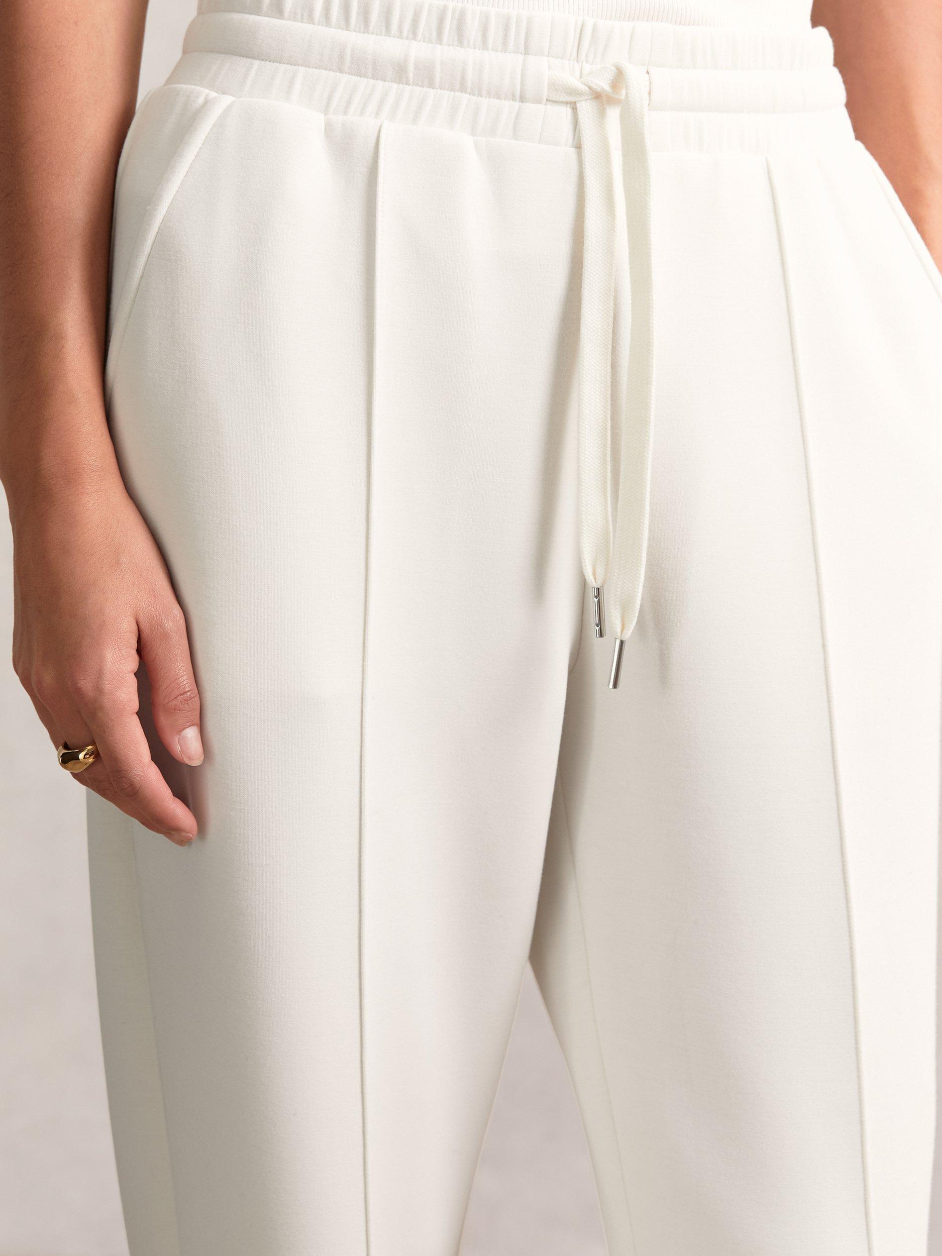 Product image 2 of 5, which shows Reiss Petite Wide Leg Tailored Joggers, Ivory, XS