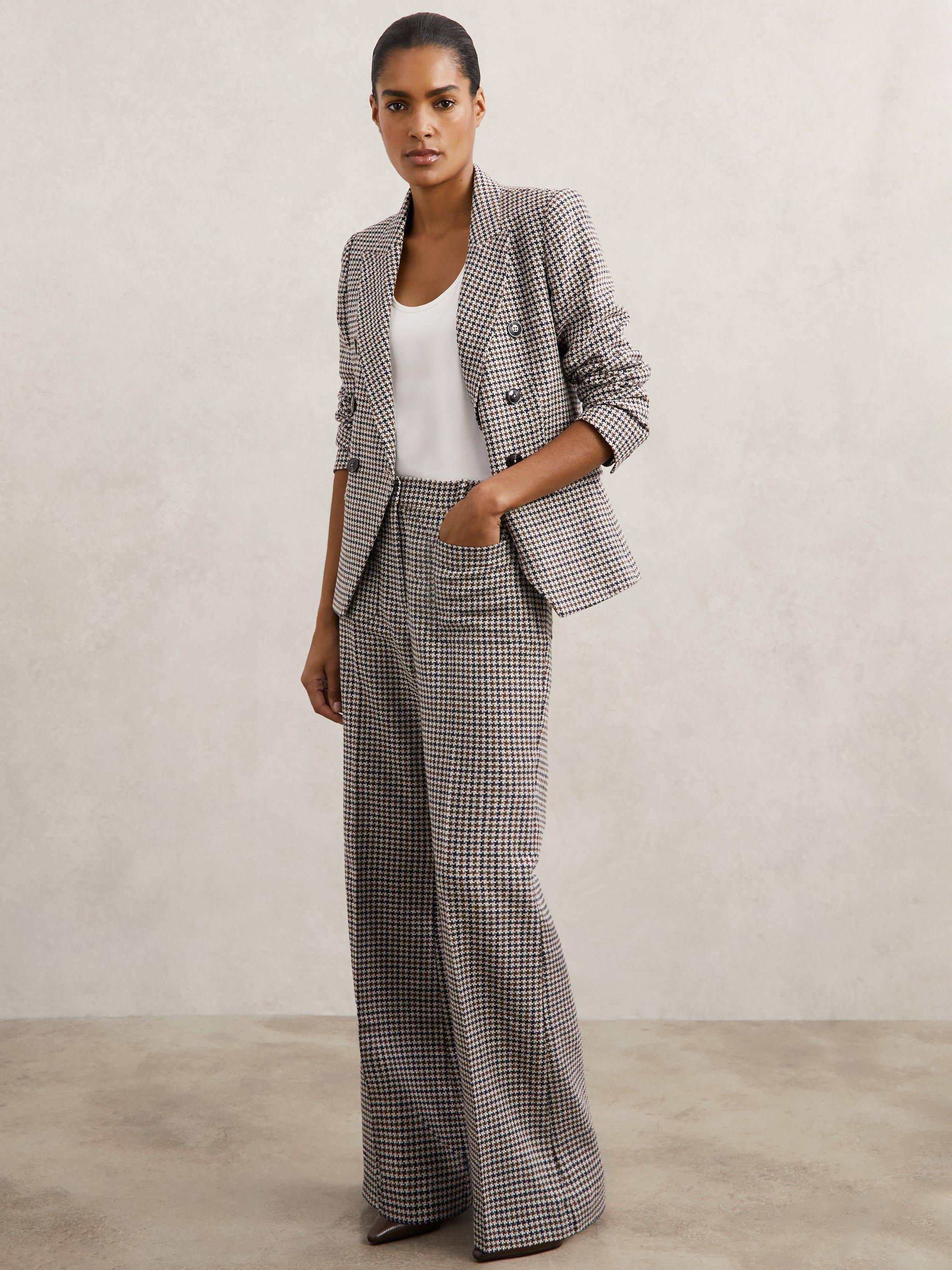 Product image 1 of 5, which shows Reiss Check Print Flare Leg Trousers, Navy/Neutral, 6R