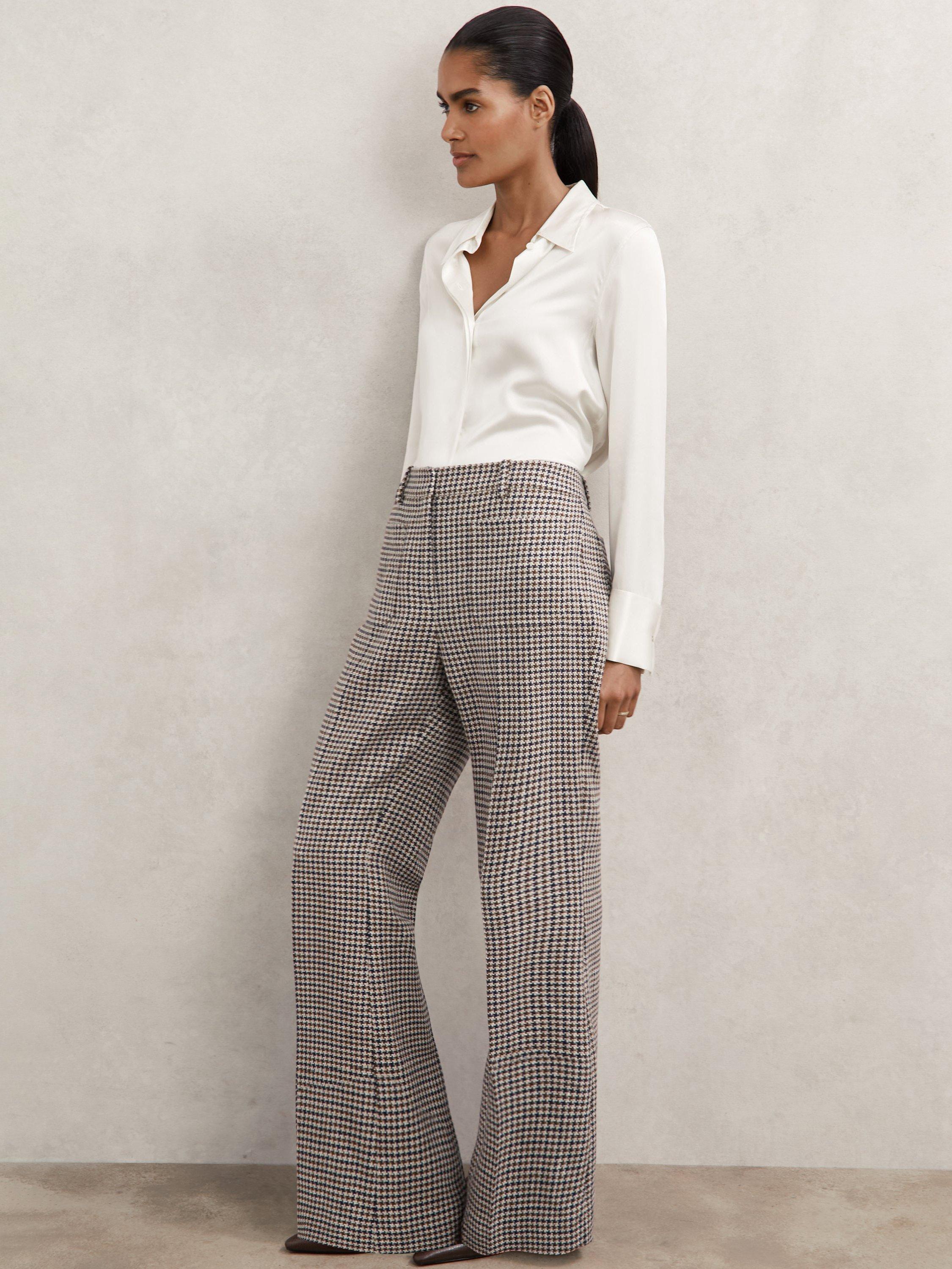 Product image 5 of 5, which shows Reiss Check Print Flare Leg Trousers, Navy/Neutral, 6R