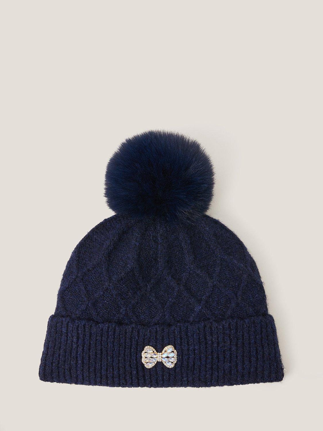 Product image 1 of 2, which shows Monsoon Kids' Diamond Bow Pom Pom Beanie Hat, Navy, 3-6 years