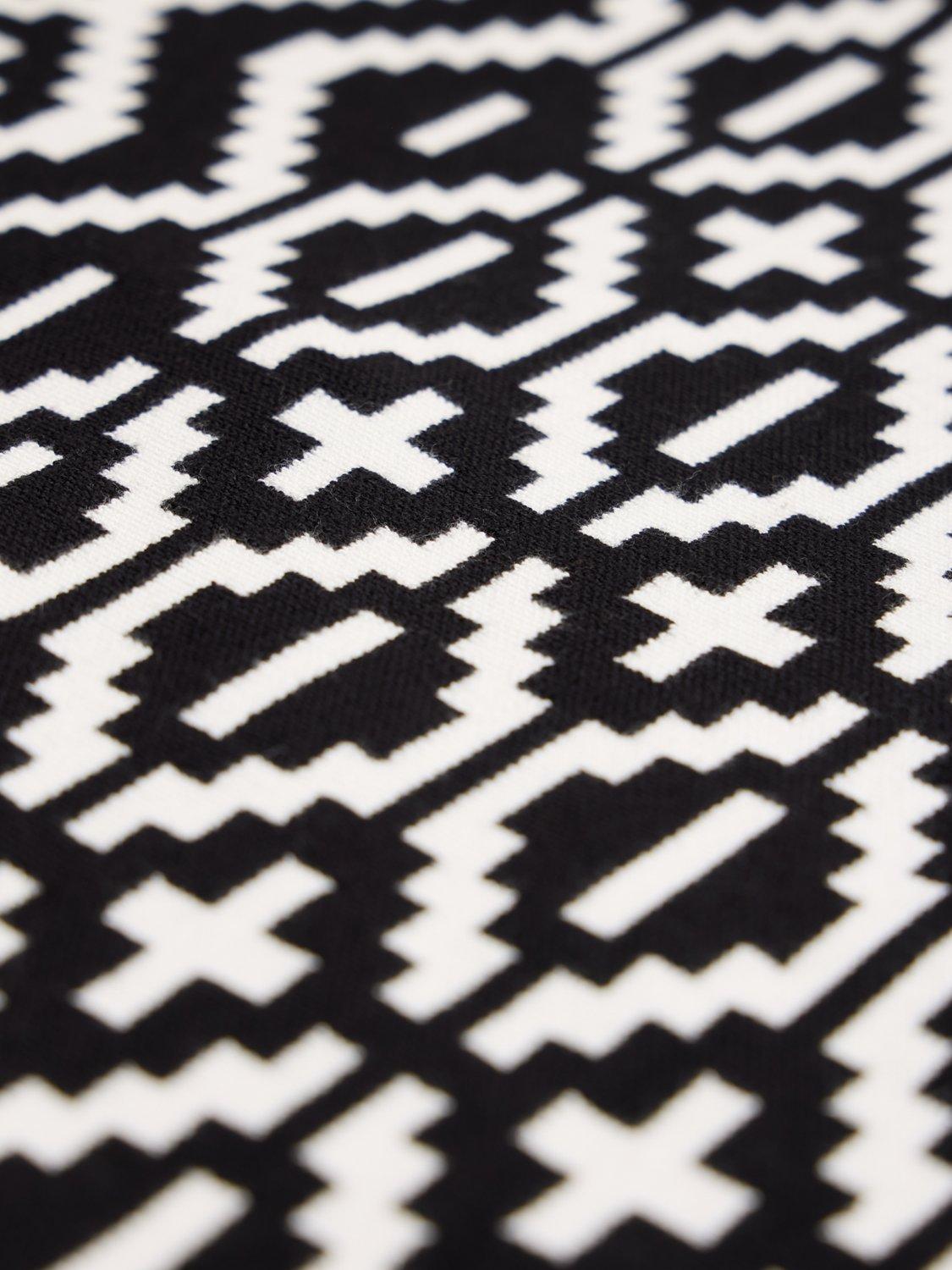 Product image 6 of 7, which shows The Little Tailor Slim Roll Neck Geometric Jumper, Black, XS