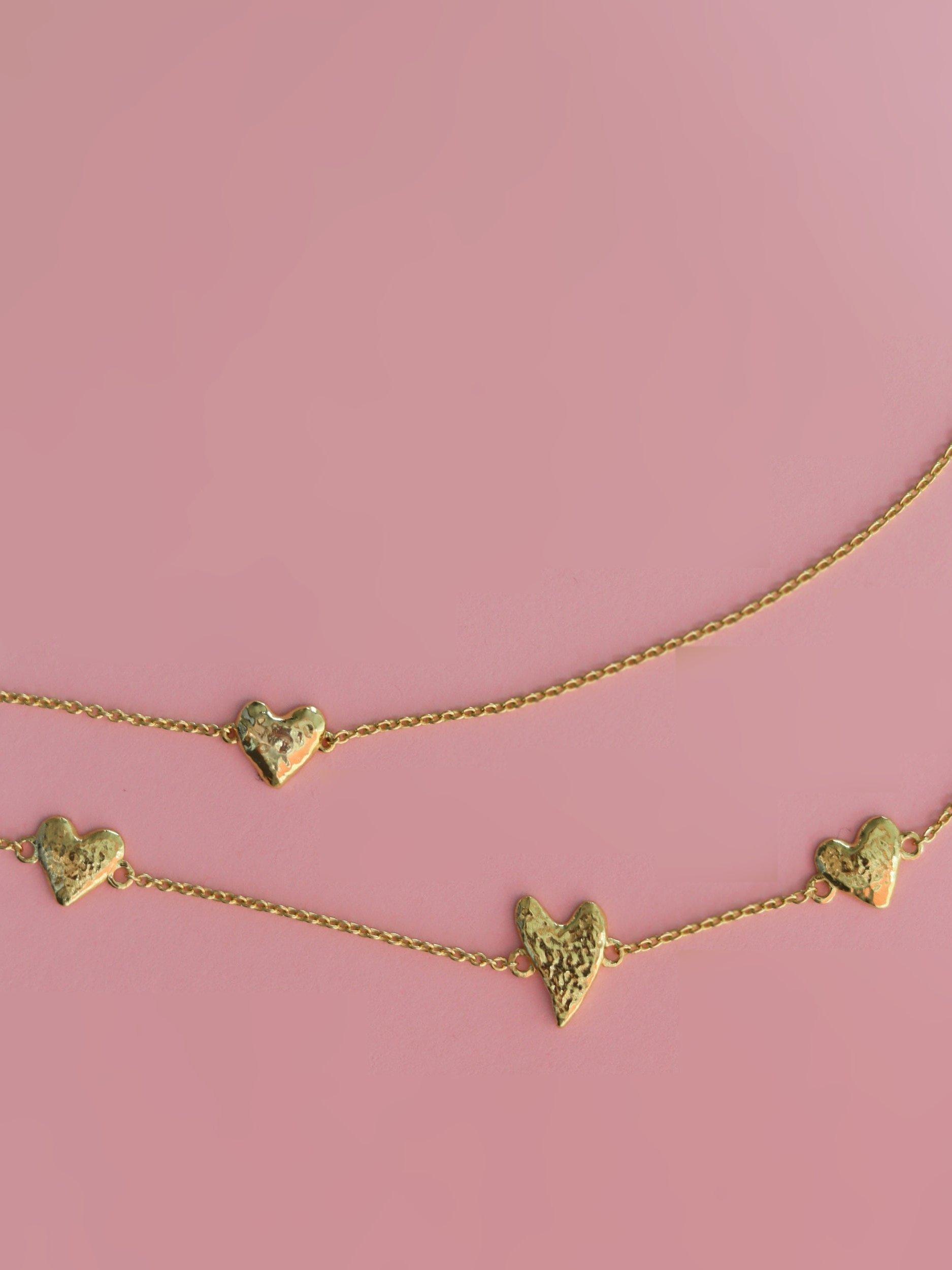 Product image 2 of 6, which shows Ottoman Hands Triple Heart Bracelet, Gold