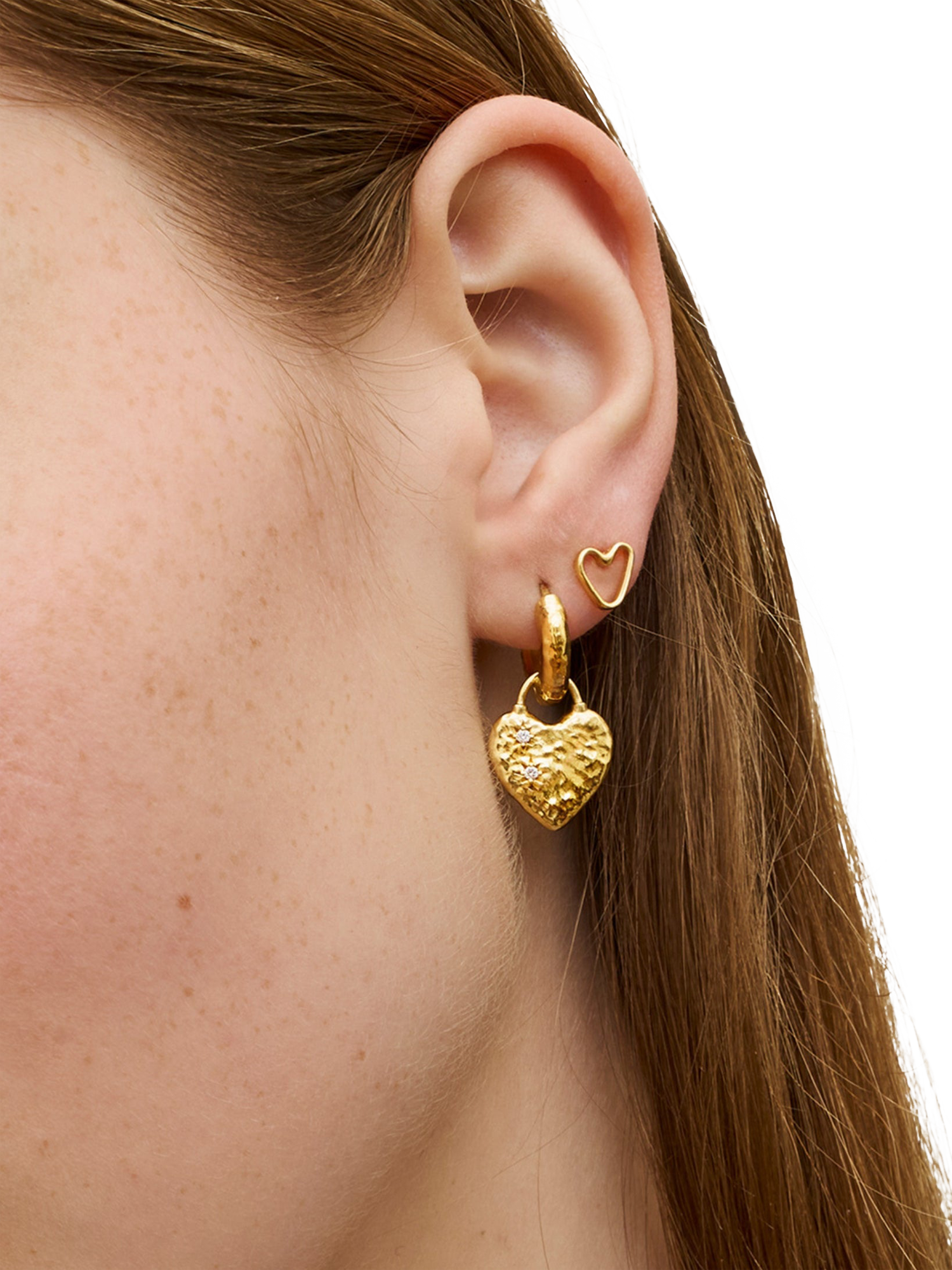 Product image 2 of 7, which shows Ottoman Hands Heart Huggie Earrings, Gold