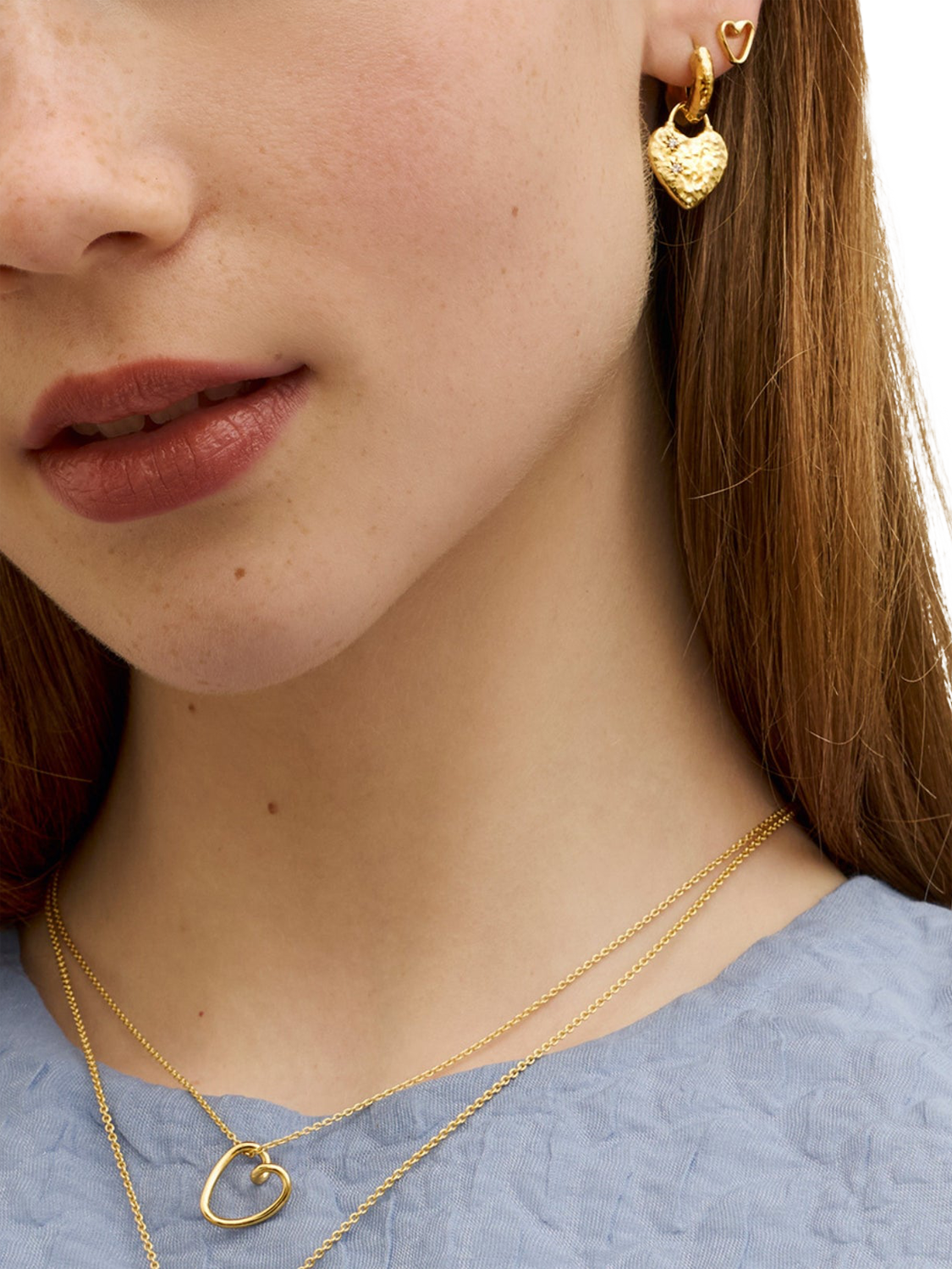 Product image 4 of 7, which shows Ottoman Hands Heart Huggie Earrings, Gold