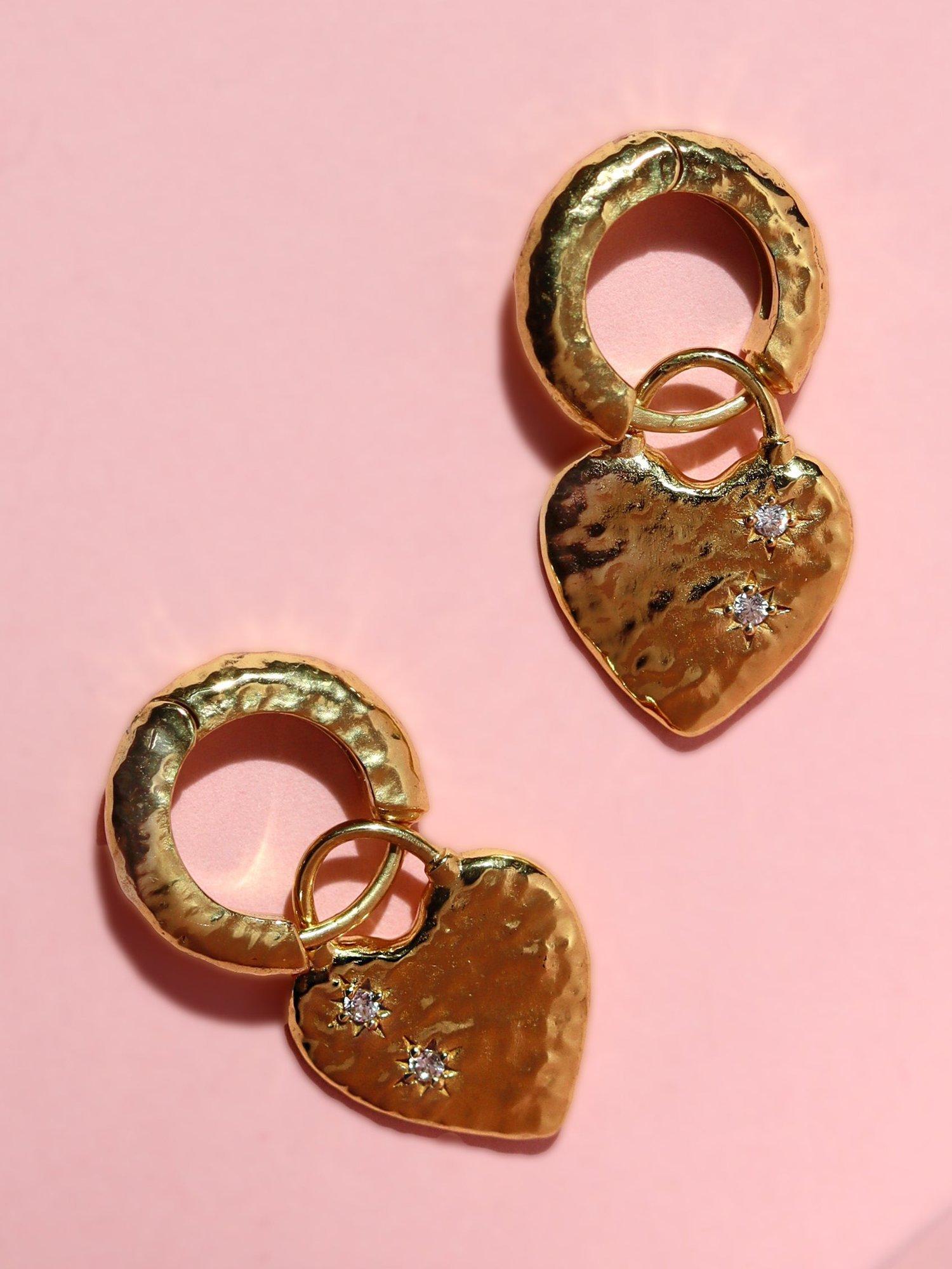 Product image 5 of 7, which shows Ottoman Hands Heart Huggie Earrings, Gold