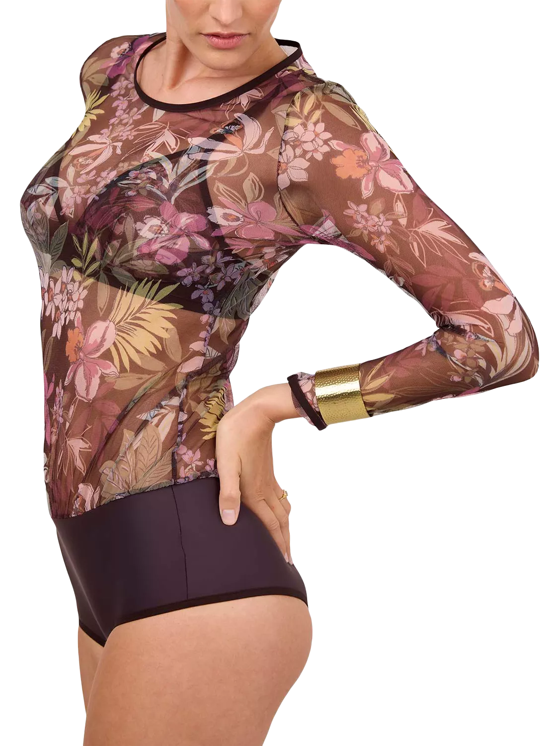 Woman wearing a purple floral bodysuit