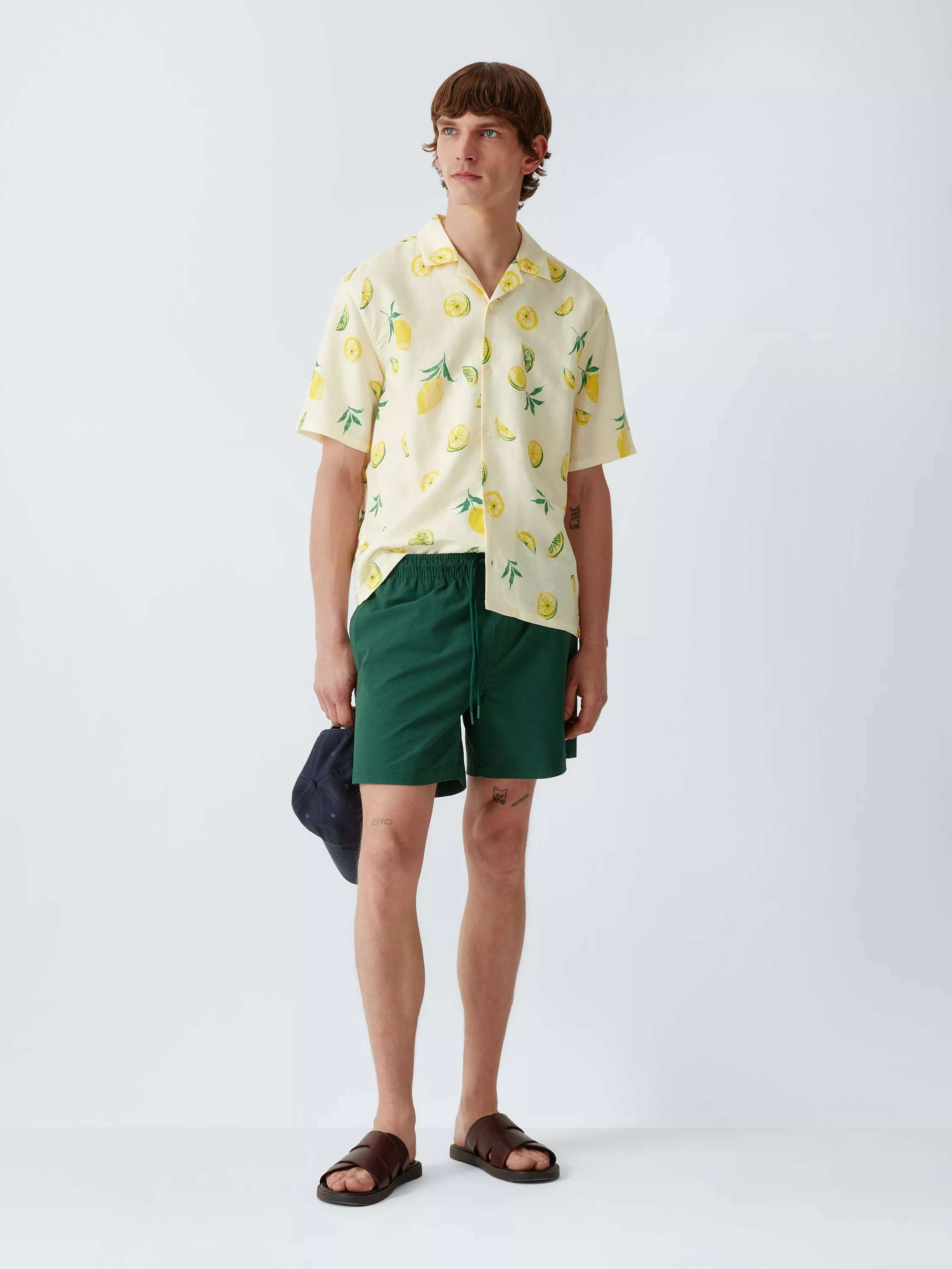 man wearing linene shirt and shorts