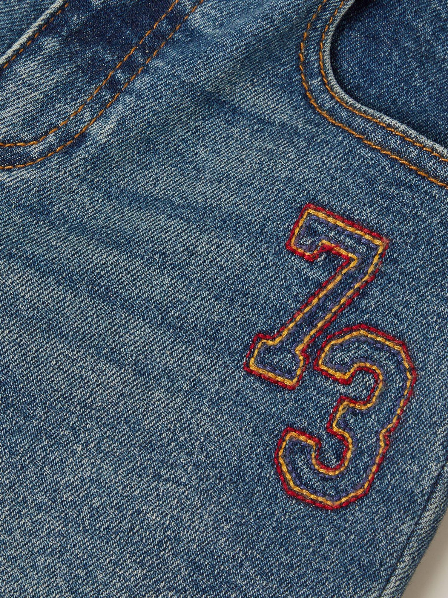 Product image 4 of 4, which shows Monsoon Kids' Denim Logo Straight Jeans, Mid Blue, 2-3 years