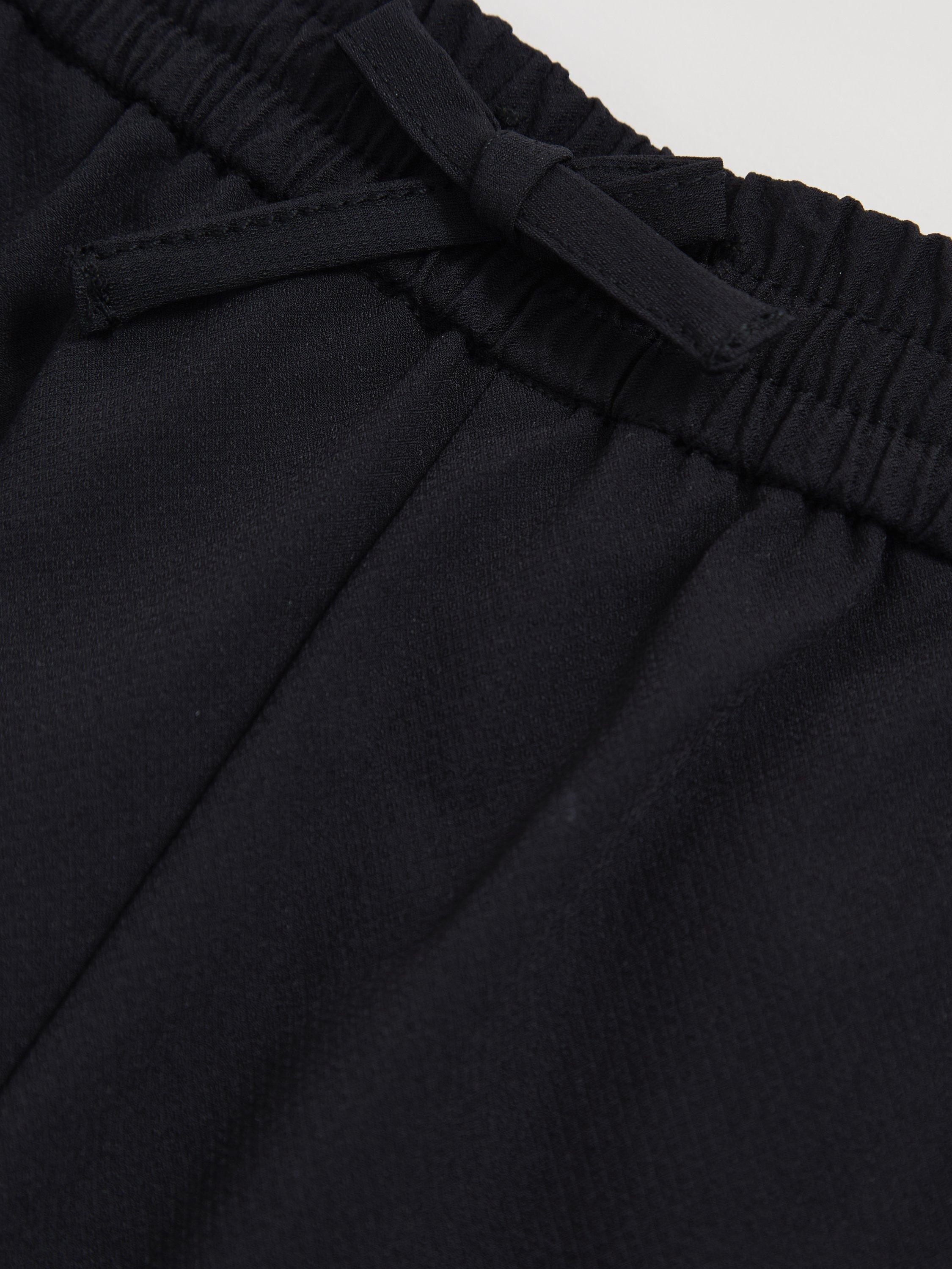 Product image 4 of 4, which shows Reiss Kids' Lucian Drawstring Trousers, Black, 3-4 years