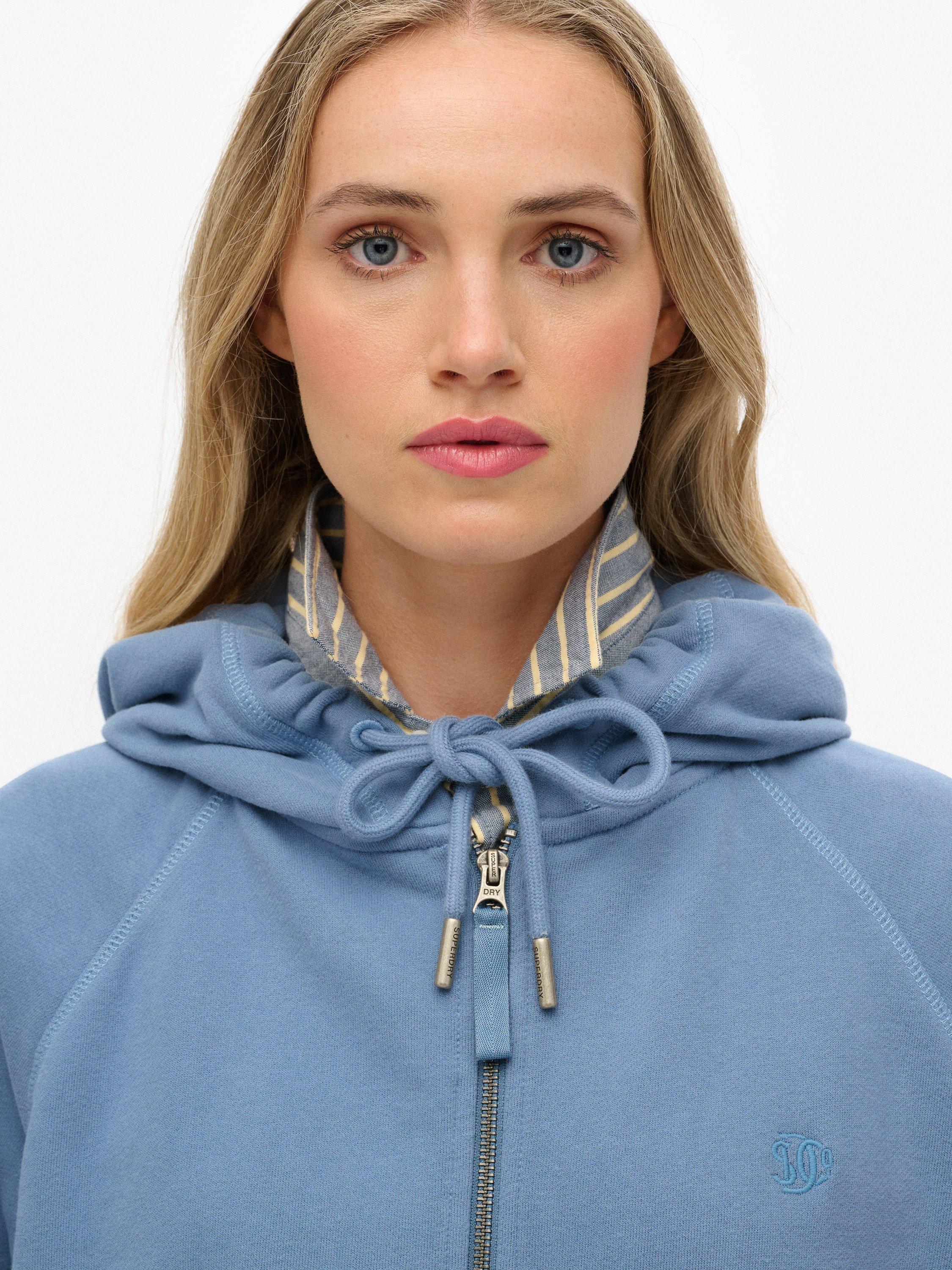 Product image 5 of 6, which shows Superdry Studios Relaxed Zip Hoodie, Tidal Blue, 16