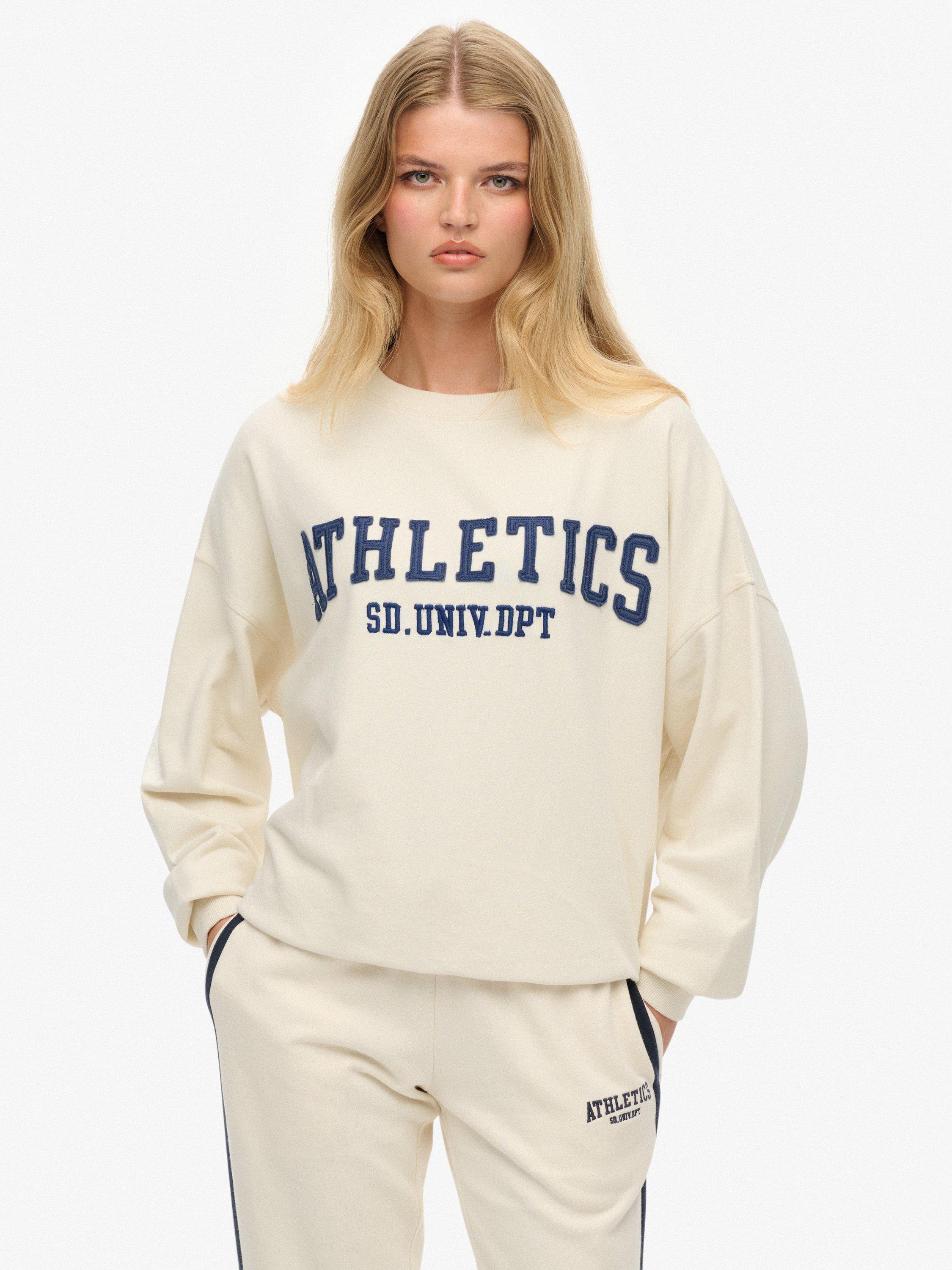 Product image 1 of 6, which shows Superdry Athletic Essentials Applique Crew Sweatshirt, Desert Bone Offwhite, 16