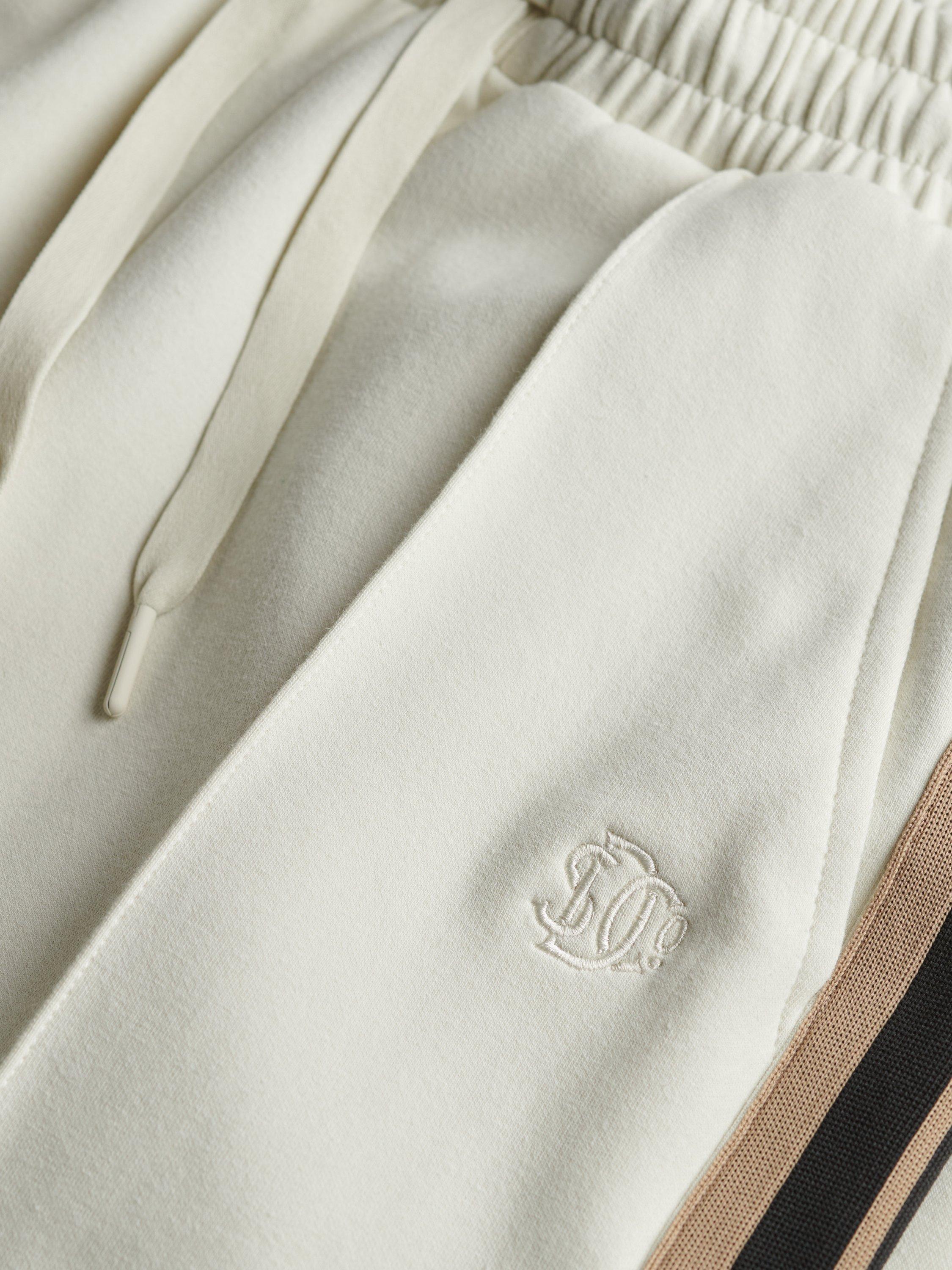 Product image 7 of 7, which shows Superdry Studios Stripe Straight Joggers, Off White, 14