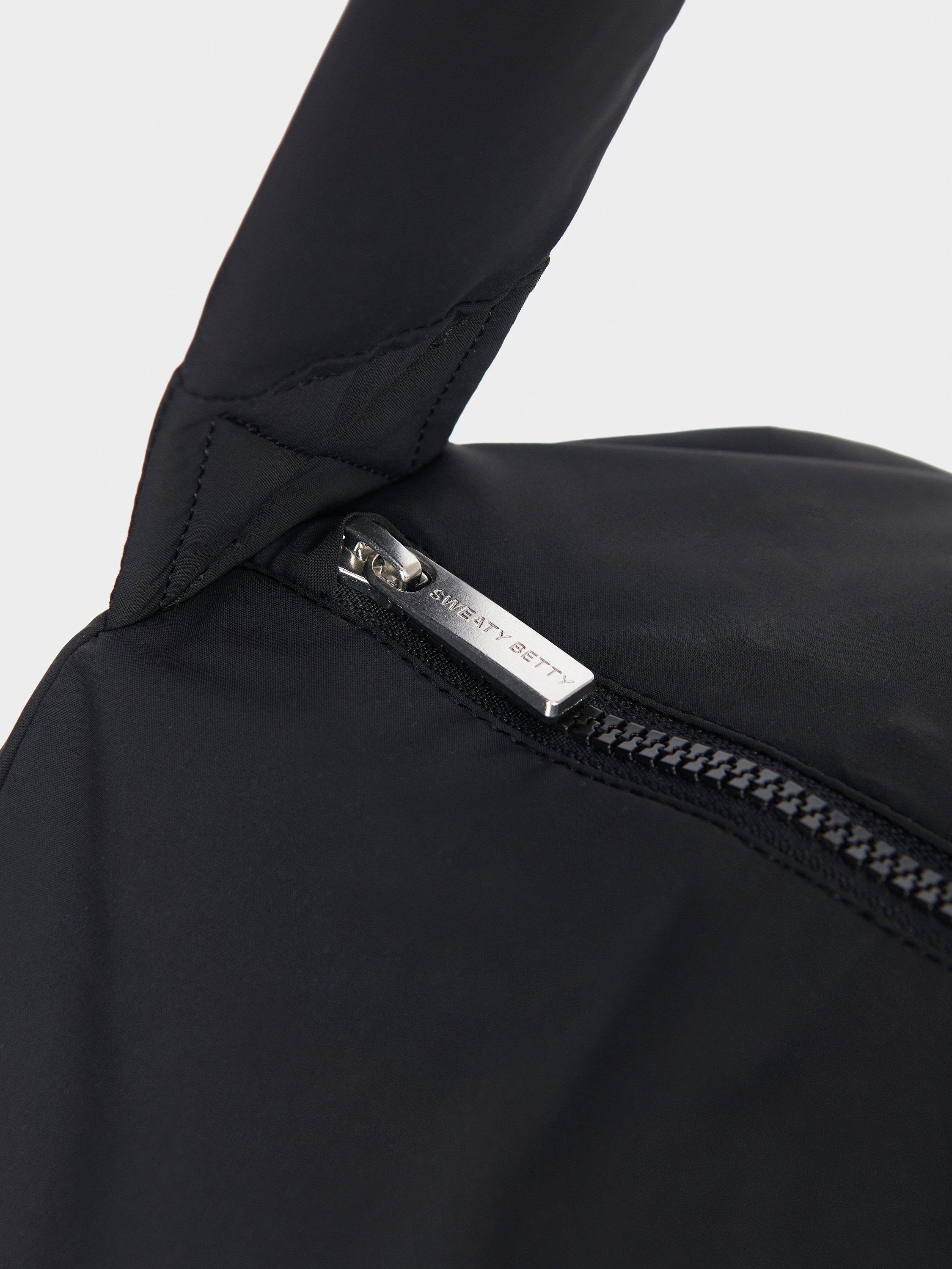 Product image 4 of 4, which shows Sweaty Betty Nimbus Cloud Duffel Bag, Black, One Size